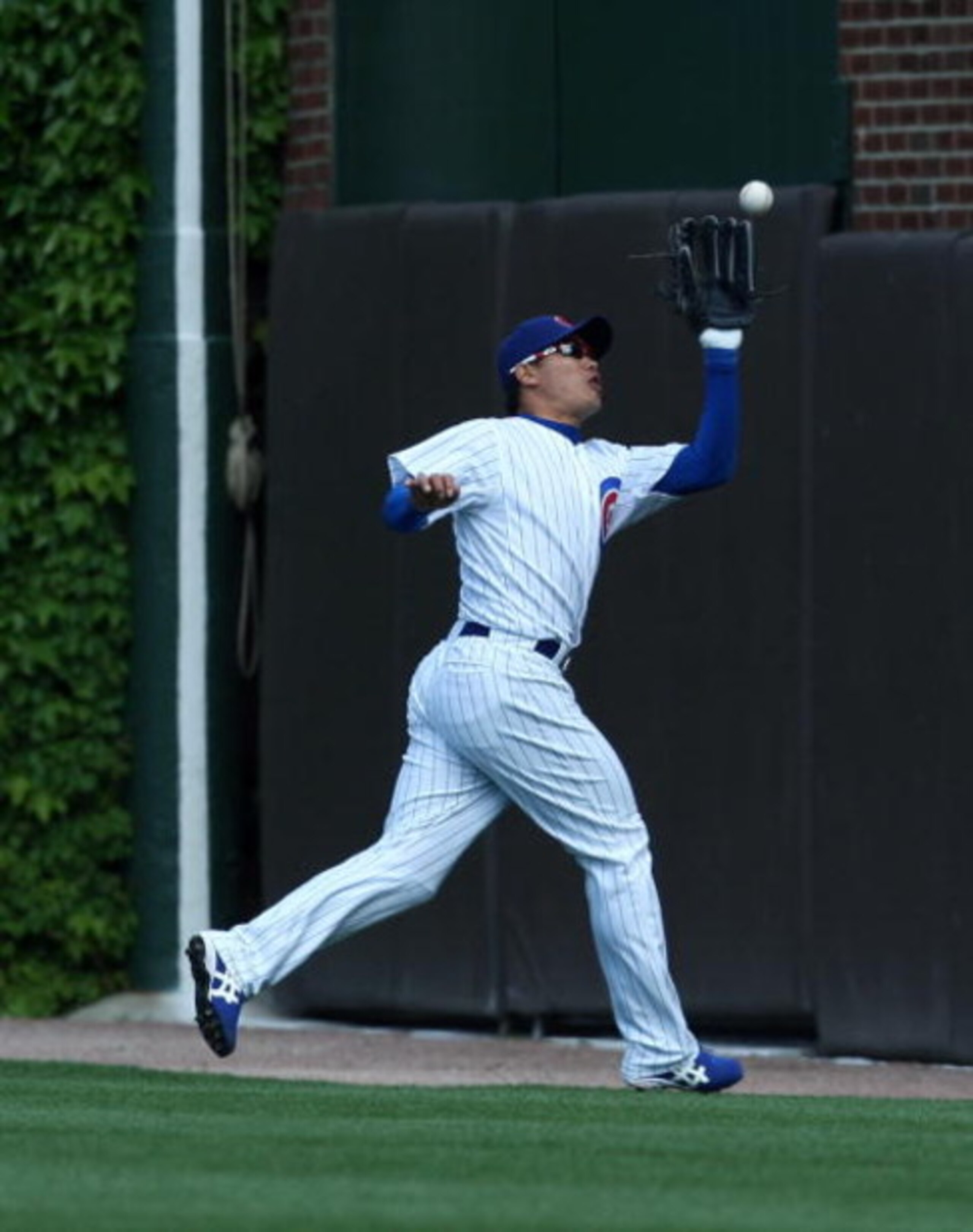 CHICAGO - MAY 29: Kosuke Fukudome #1 of the Chicago Cubs catches a fly ball in right field in the 9th inning against the Los Angeles Dodgers on May 29, 2009 at Wrigley Field in Chicago, Illinois. The Cubs defeated the Dodgers 2-1. (Photo by Jonathan Danie