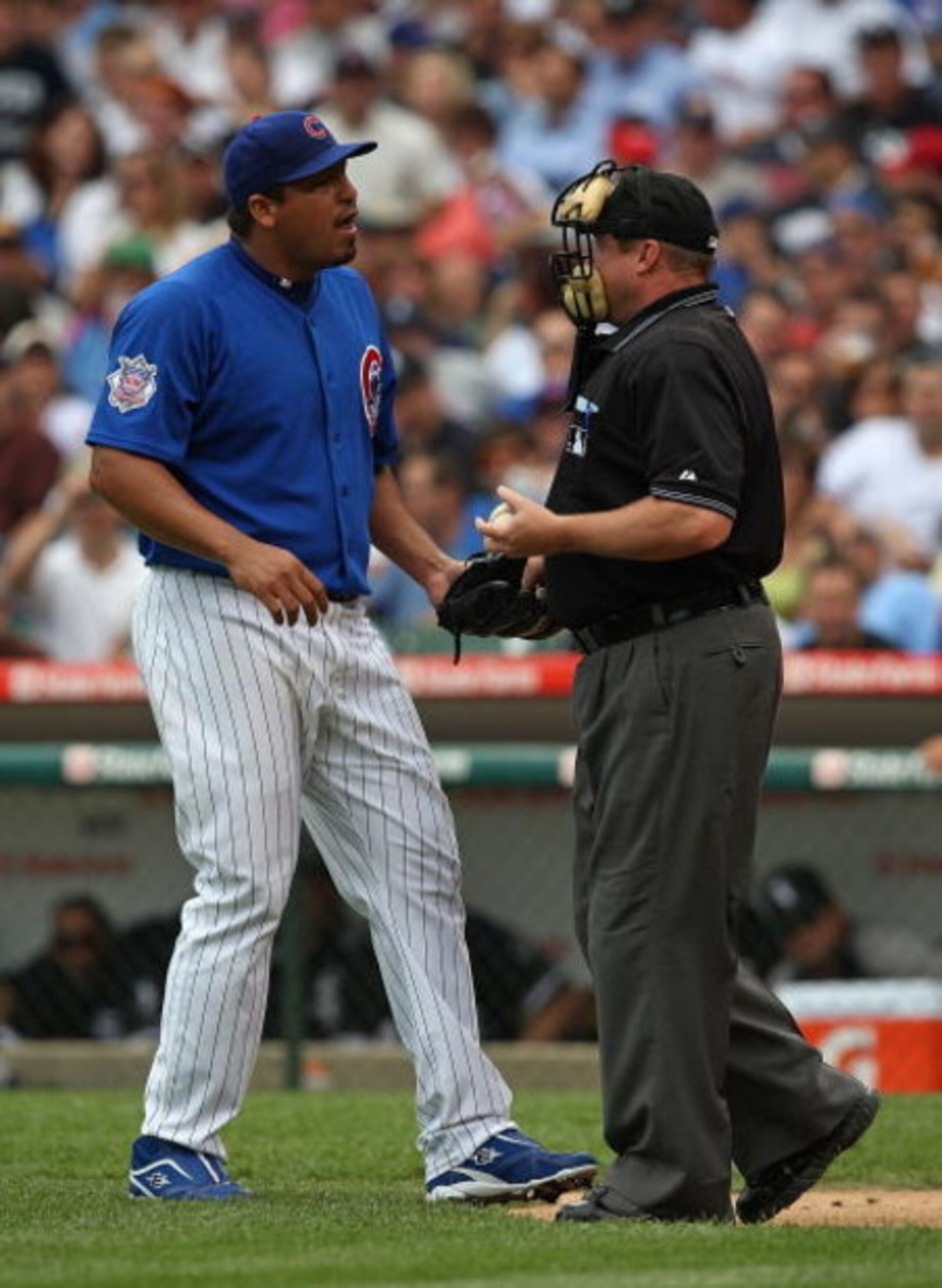 CHICAGO - JUNE 18: Carlos Zambrano #38 of the Chicago Cubs talks with home plate umpire Bruce Dreckman #1 after hitting batter Gordon Beckham of the Chicago White Sox in the 2nd inning on June 18, 2009 at Wrigley Field in Chicago, Illinois. The Cubs defea