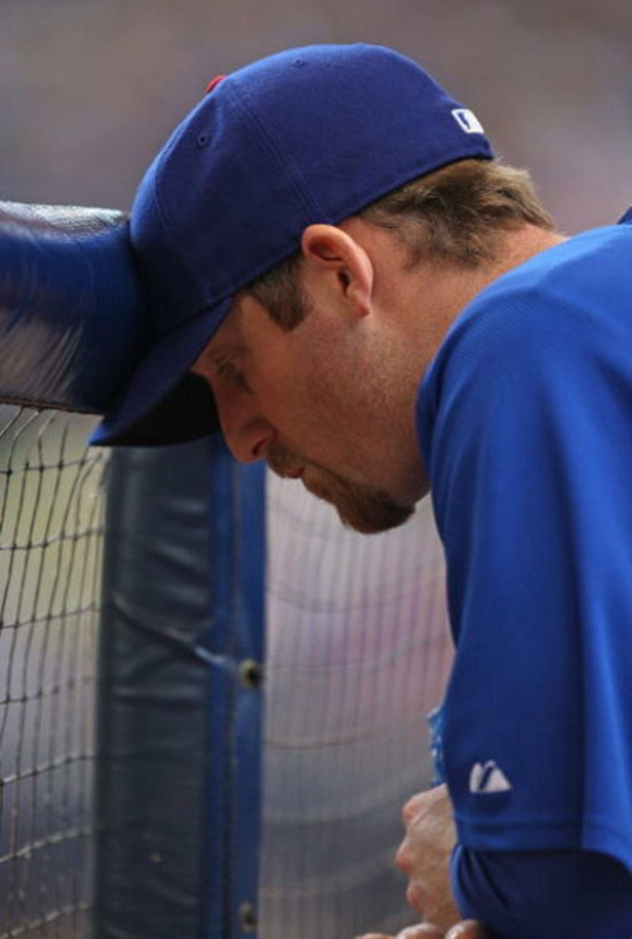 MILWAUKEE - MAY 10: Ryan Dempster #46 of the Chicago Cubs leans his head on the dugout fence during a game against the Milwaukee Brewers on May 10, 2009 at Miller Park in Milwaukee, Wisconsin. The Cubs defeated the Brewers 4-2. (Photo by Jonathan Daniel/G
