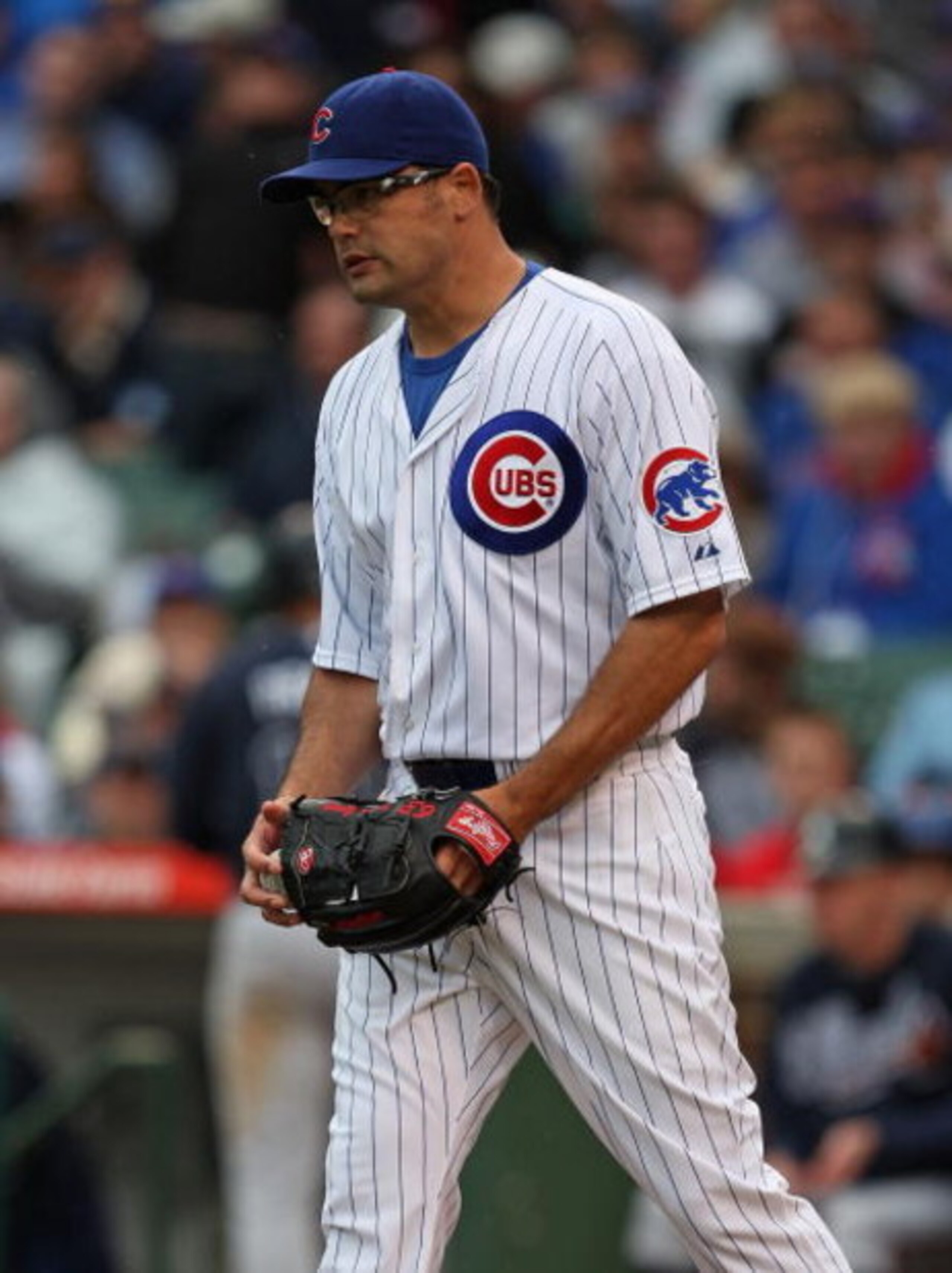 CHICAGO - JULY 08: Kevin Gregg #63 of the Chicago Cubs reacts after throwing a wild pitch in the 9th inning that allowed an Atlanta Braves runner to score on July 8, 2009 at Wrigley Field in Chicago, Illinois. The Braves defeated the Cubs 4-1. (Photo by J