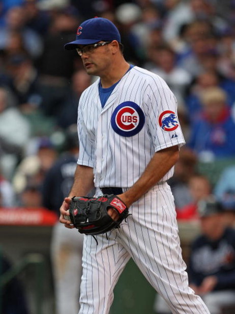 CHICAGO - JULY 08: Kevin Gregg #63 of the Chicago Cubs reacts after throwing a wild pitch in the 9th inning that allowed an Atlanta Braves runner to score on July 8, 2009 at Wrigley Field in Chicago, Illinois. The Braves defeated the Cubs 4-1. (Photo by J