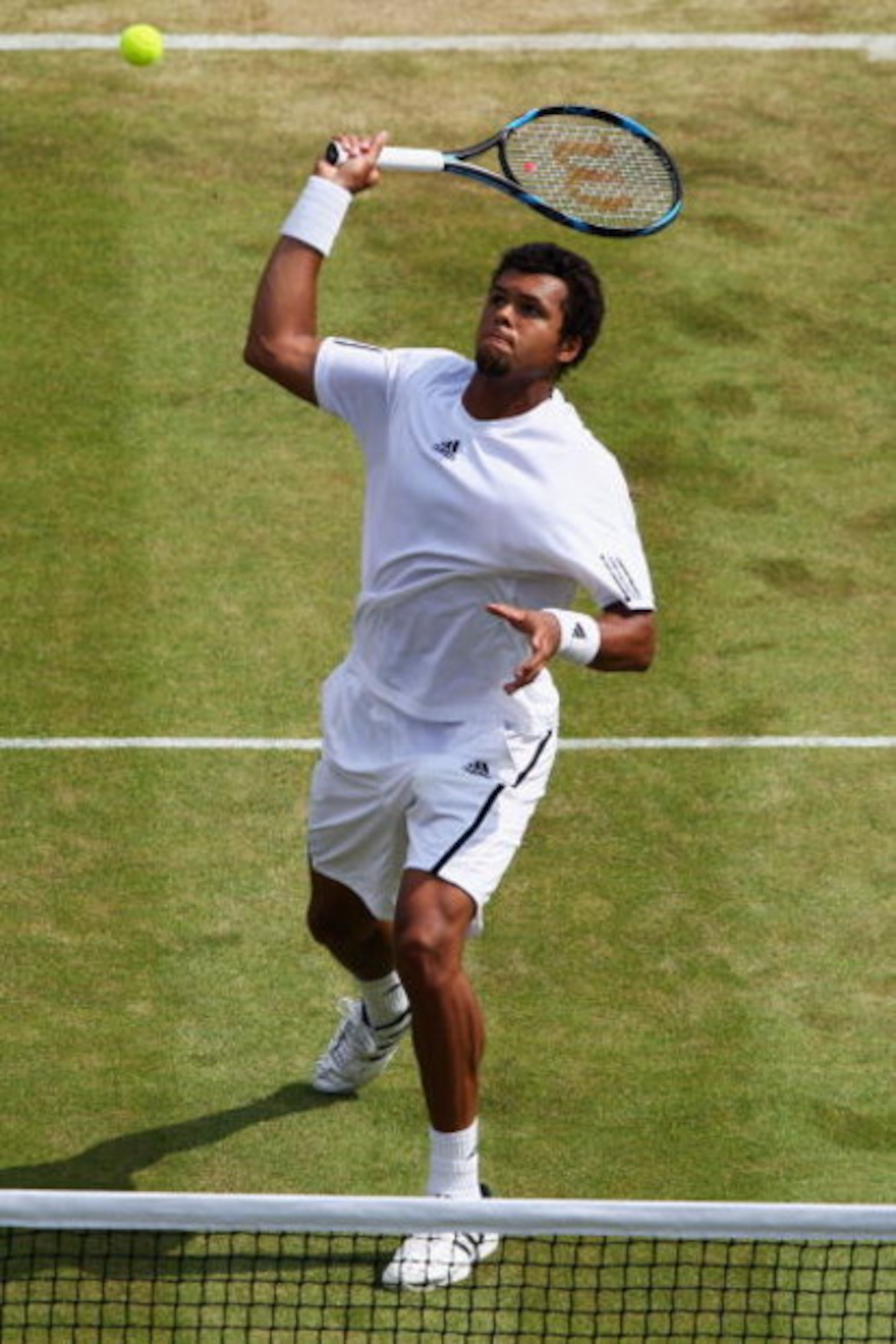 WIMBLEDON, ENGLAND - JUNE 26:  Jo-Wilfried Tsonga of France plays a smash during the men's singles third round match against Ivo Karlovic of Croatia on Day Five of the Wimbledon Lawn Tennis Championships at the All England Lawn Tennis and Croquet Club on 