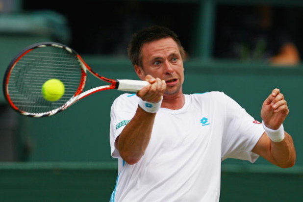 WIMBLEDON, ENGLAND - JUNE 29: Robin Soderling of Sweden plays a forehand during the men's singles fourth round match against Roger Federer of Switzerland on Day Seven of the Wimbledon Lawn Tennis Championships at the All England Lawn Tennis and Croquet C WIMBLEDON, ENGLAND - JUNE 29: Robin Soderling of Sweden plays a forehand during the men's singles fourth round match against Roger Federer of Switzerland on Day Seven of the Wimbledon Lawn Tennis Championships at the All England Lawn Tennis and Croquet C
