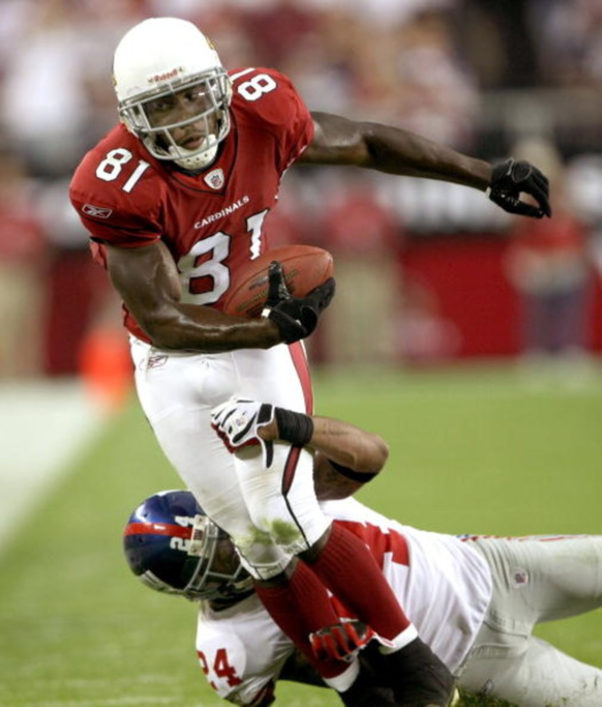 GLENDALE, AZ - NOVEMBER 23:  Wide receiver Anquan Boldin #81 of the Arizona Cardinals carries against cornerback Terrell Thomas #24 of the New York Giants on November 23, 2008 at University of Phoenix Stadium in Glendale, Arizona. The Giants won 37-29.  (