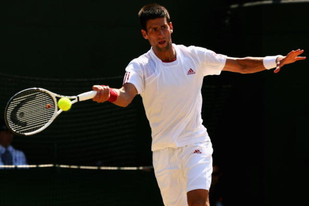 WIMBLEDON, ENGLAND - JULY 01: Novak Djokovic of Serbia plays forehand during the men's singles quarter final match against Tommy Haas of Germany on Day Nine of the Wimbledon Lawn Tennis Championships at the All England Lawn Tennis and Croquet Club on Jul WIMBLEDON, ENGLAND - JULY 01: Novak Djokovic of Serbia plays forehand during the men's singles quarter final match against Tommy Haas of Germany on Day Nine of the Wimbledon Lawn Tennis Championships at the All England Lawn Tennis and Croquet Club on Jul