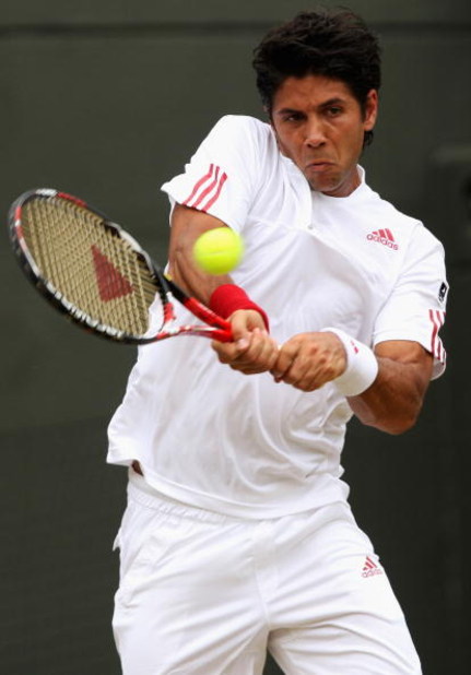 WIMBLEDON, ENGLAND - JUNE 29: Fernando Verdasco of Spain plays a backhand during the men's singles fourth round match against Ivo Karlovic of Croatia on Day Seven of the Wimbledon Lawn Tennis Championships at the All England Lawn Tennis and Croquet Club WIMBLEDON, ENGLAND - JUNE 29: Fernando Verdasco of Spain plays a backhand during the men's singles fourth round match against Ivo Karlovic of Croatia on Day Seven of the Wimbledon Lawn Tennis Championships at the All England Lawn Tennis and Croquet Club