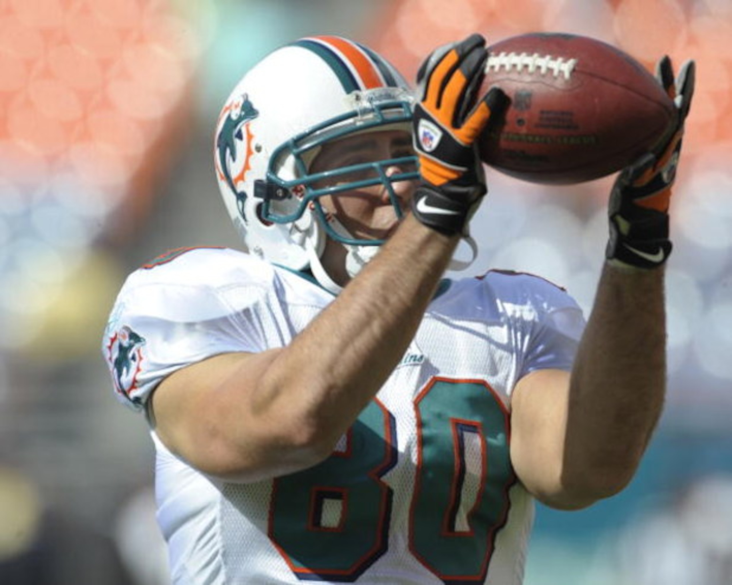 MIAMI, FL - JANUARY 4:  Tight end Anthony Fasano #80 of the Miami Dolphins grabs a warm up pass before play against the Baltimore Ravens in an NFL Wildcard Playoff Game at Dolphins Stadium on January 4, 2009 in Miami, Florida.  (Photo by Al Messerschmidt/