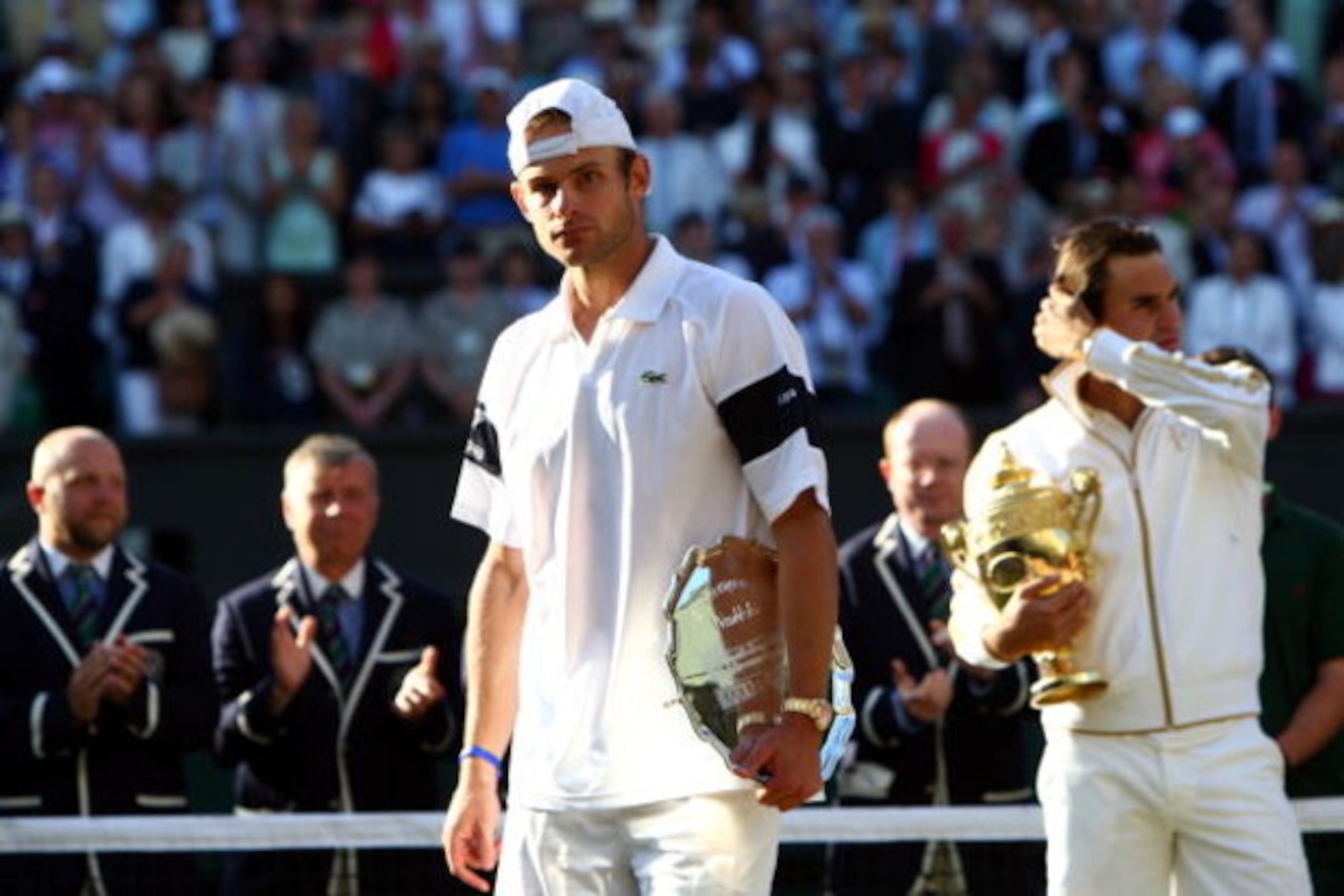 WIMBLEDON, ENGLAND - JULY 05:  Andy Roddick of USA looks despondent after defeat during the men's singles final match against Roger Federer of Switzerland on Day Thirteen of the Wimbledon Lawn Tennis Championships at the All England Lawn Tennis and Croque