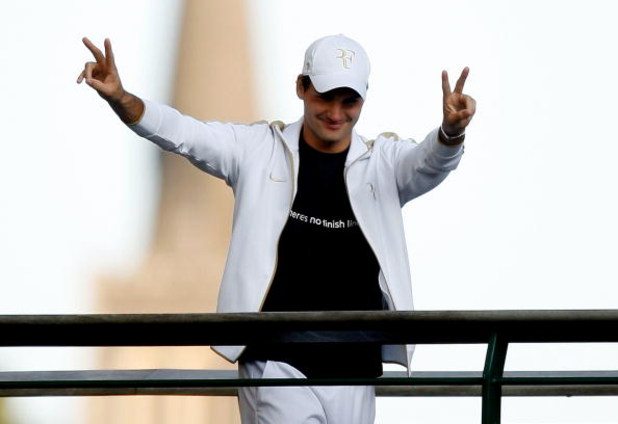 WIMBLEDON, ENGLAND - JULY 05: Roger Federer of Switzerland salutes spectators after victory in the men's singles final match against Andy Roddick of USA on Day Thirteen of the Wimbledon Lawn Tennis Championships at the All England Lawn Tennis and Croquet WIMBLEDON, ENGLAND - JULY 05: Roger Federer of Switzerland salutes spectators after victory in the men's singles final match against Andy Roddick of USA on Day Thirteen of the Wimbledon Lawn Tennis Championships at the All England Lawn Tennis and Croquet