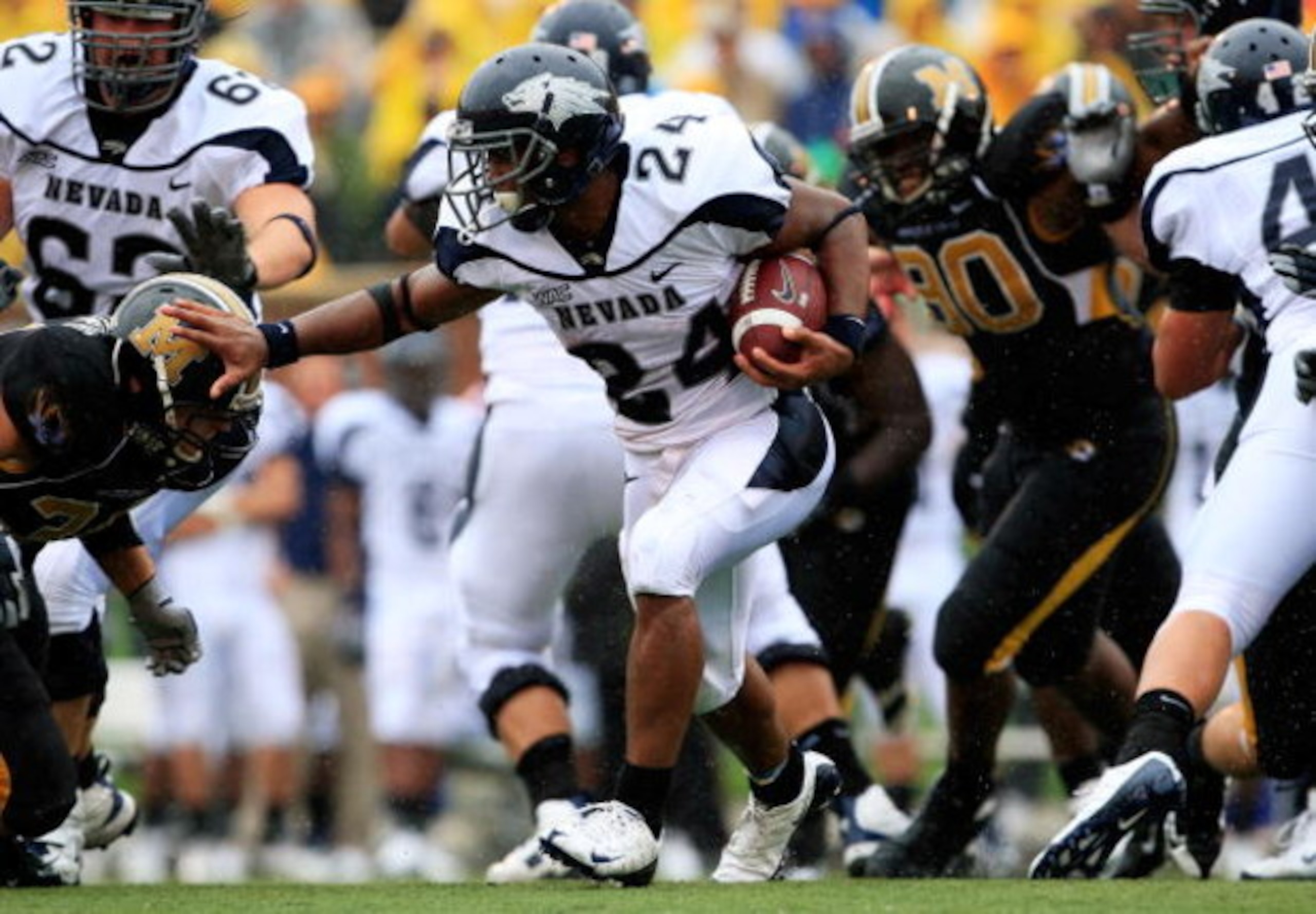 COLUMBIA, MO - SEPTEMBER 13:  Vai Taua #34 the Nevada Wolf Pack carries the ball during the first half of the game against the Missouri Tigers on September 13, 2008 at Memorial Stadium in Columbia, Missouri.  (Photo by Jamie Squire/Getty Images)