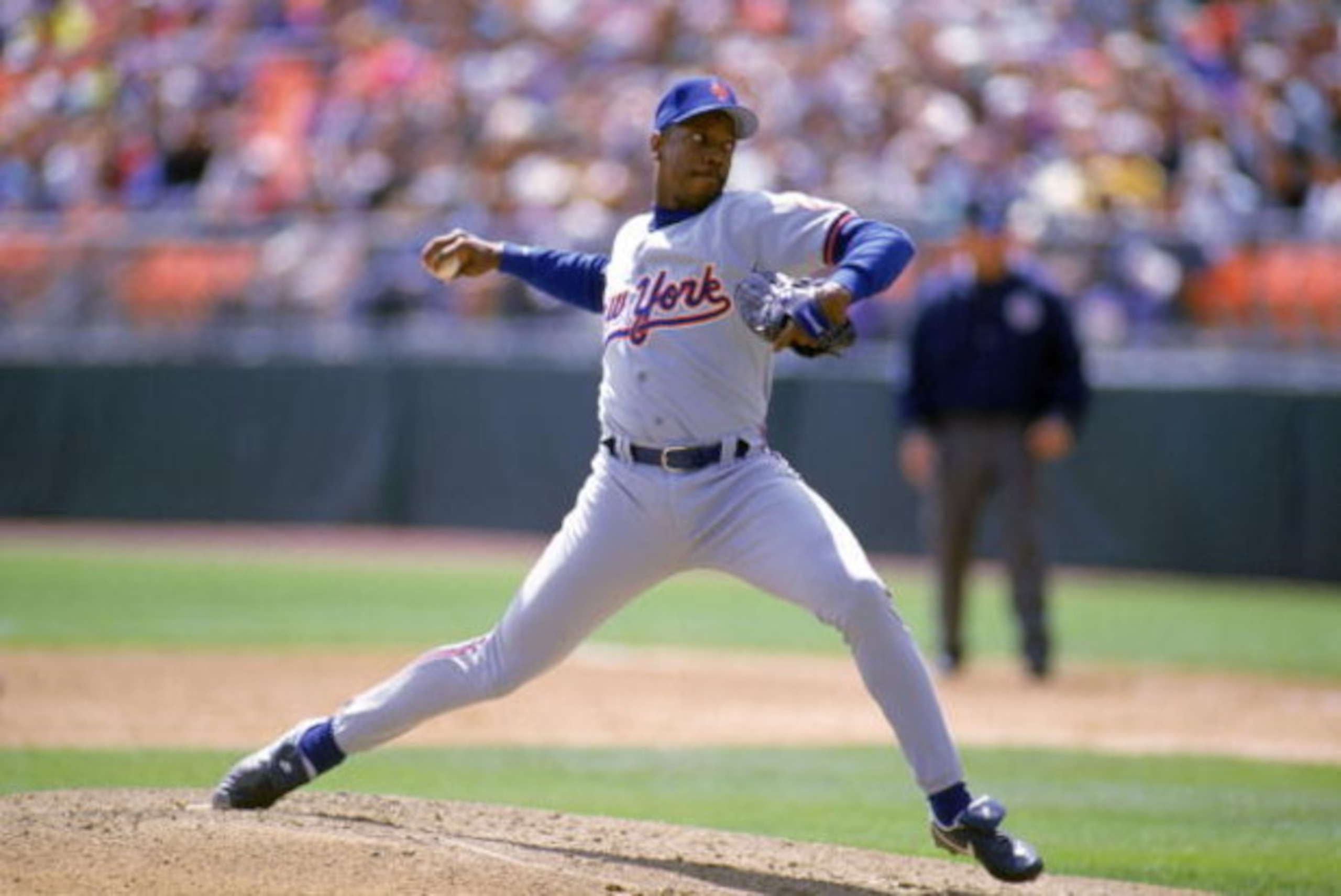 DENVER - APRIL 15:  Dwight Gooden #16 of the New York Mets winds up for a pitch during a game against the Colorado Rockies at Coors Field on April 15, 1993 in Denver, Colorado.  (Photo by Tim DeFrisco/Getty Images)