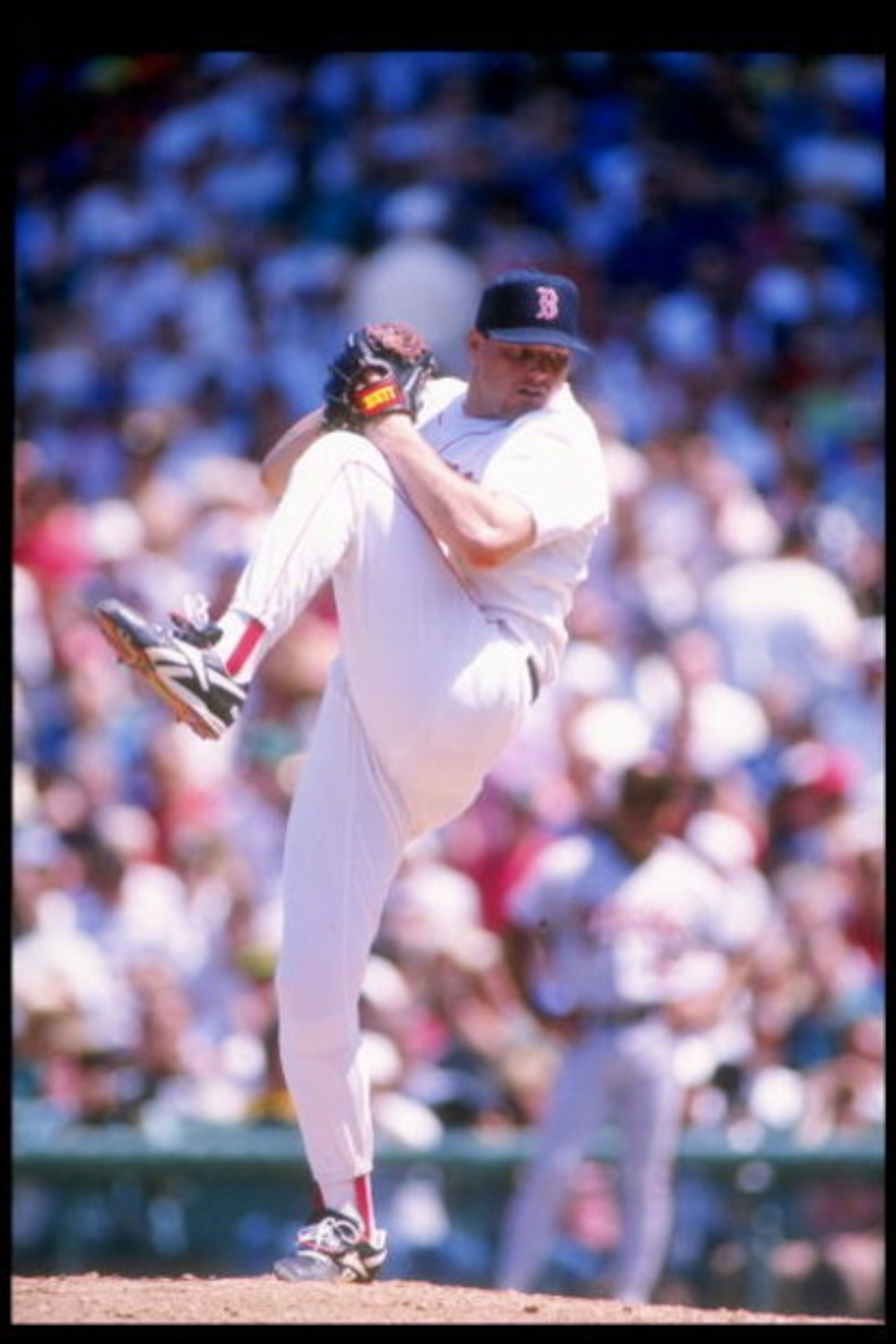 13 Jun 1993: Pitcher Roger Clemens of the Boston Red Sox winds up for the pitch during a game against the Baltimore Orioles at Fenway Park in Boston, Massachusetts.