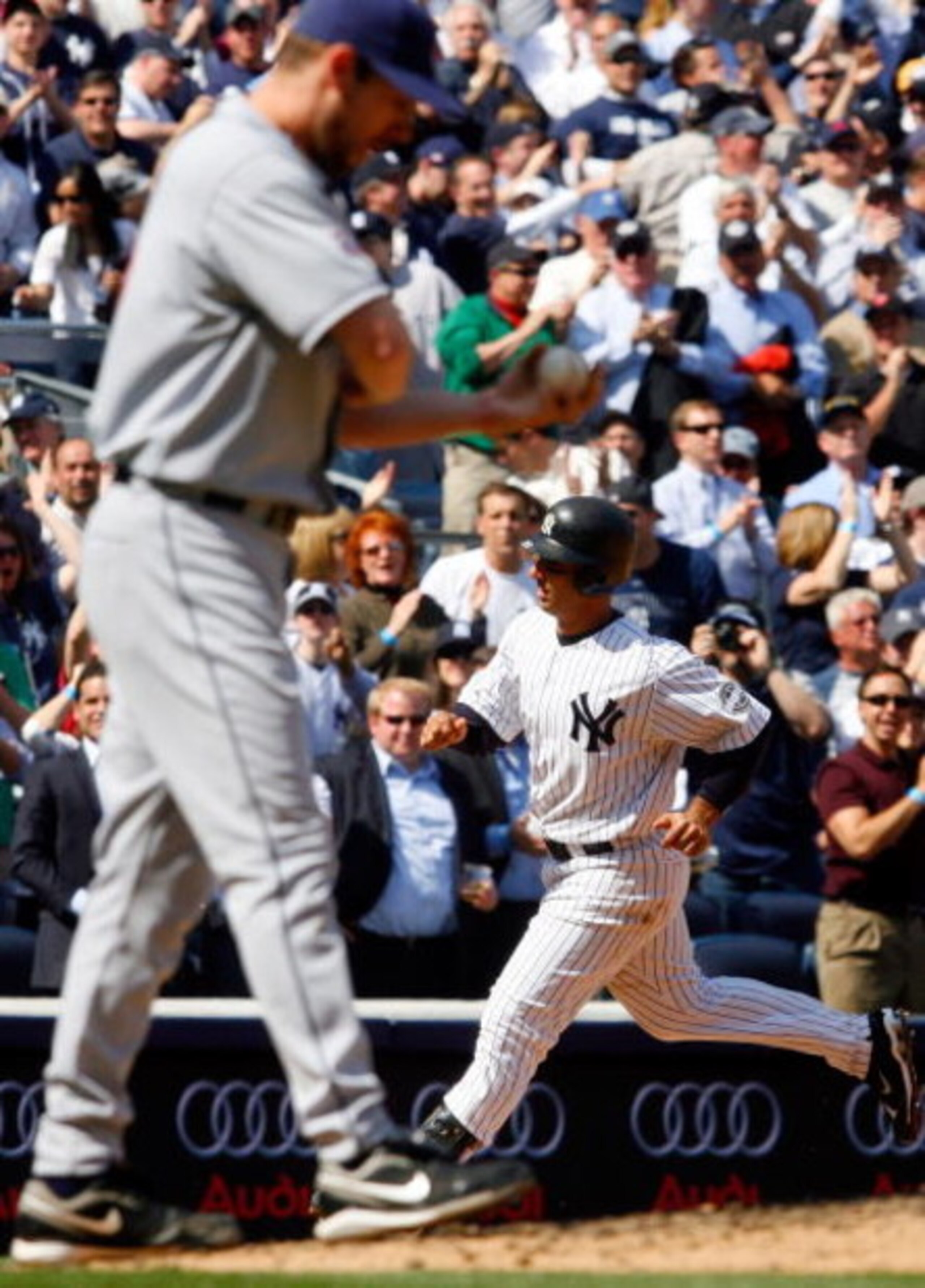 NEW YORK - APRIL 16:  Jorge Posada #20 of the New York Yankees runs the bases after hitting a fifth inning home run against Cliff Lee #31 of the Cleveland Indians on April 16, 2009 at Yankee Stadium in the Bronx borough of New York City. It was the first 