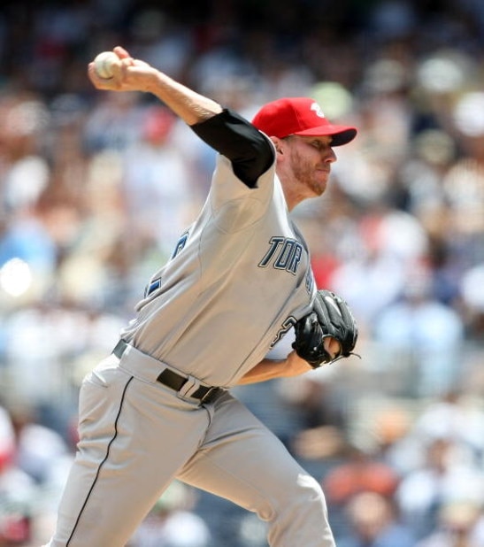 NEW YORK - JULY 04:  Roy Halladay #32 of the Toronto Blue Jays pitches against the New York Yankees on July 4, 2009 at Yankee Stadium in the Bronx borough of New York City.  (Photo by Nick Laham/Getty Images)