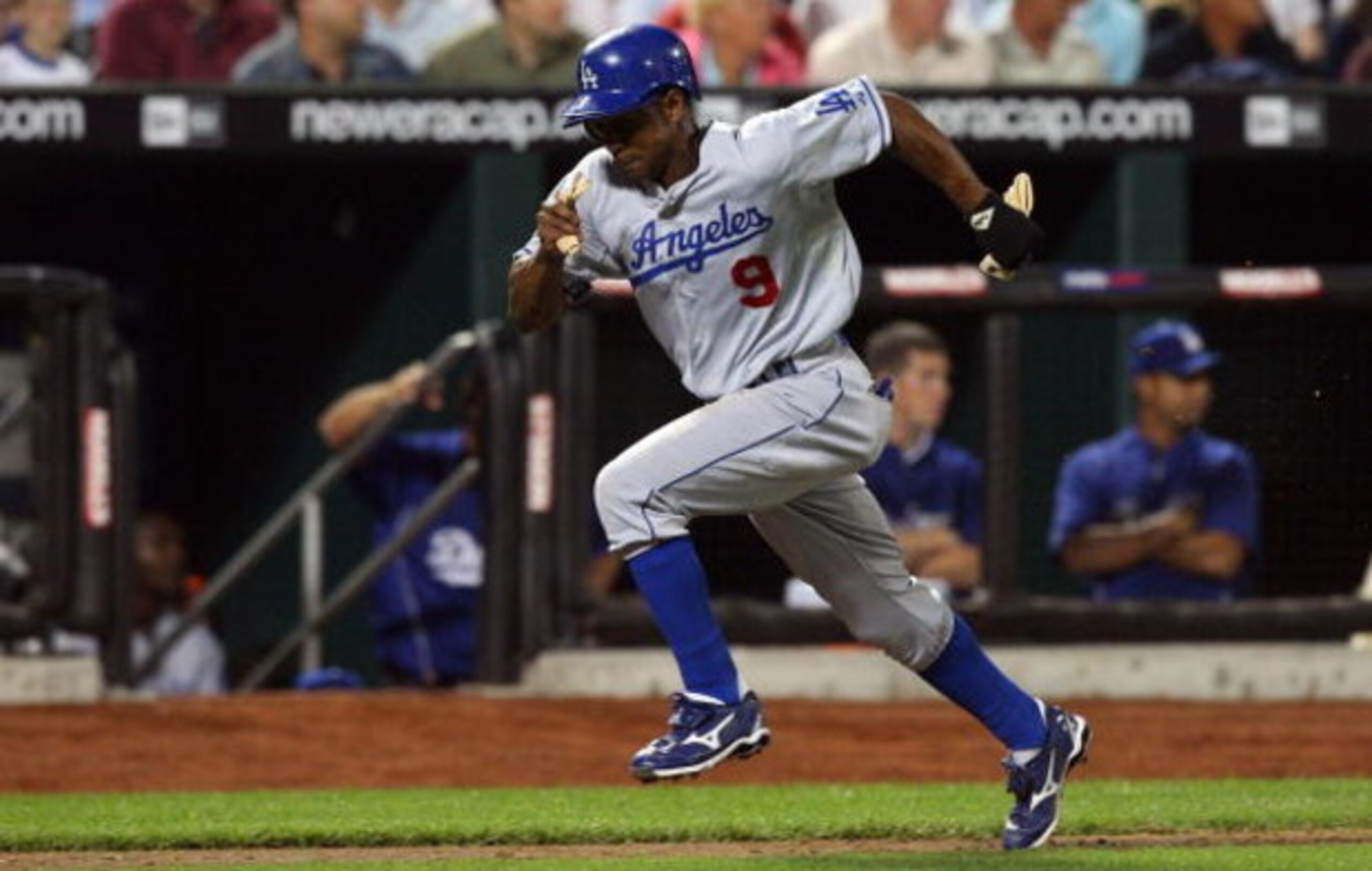 NEW YORK - JULY 07:  Juan Pierre #9 of the Los Angeles Dodgers scores a run in the eigth inning against the New York Mets on July 7, 2009 at Citi Field in the Flushing neighborhood of the Queens borough of New York City.  (Photo by Jim McIsaac/Getty Image