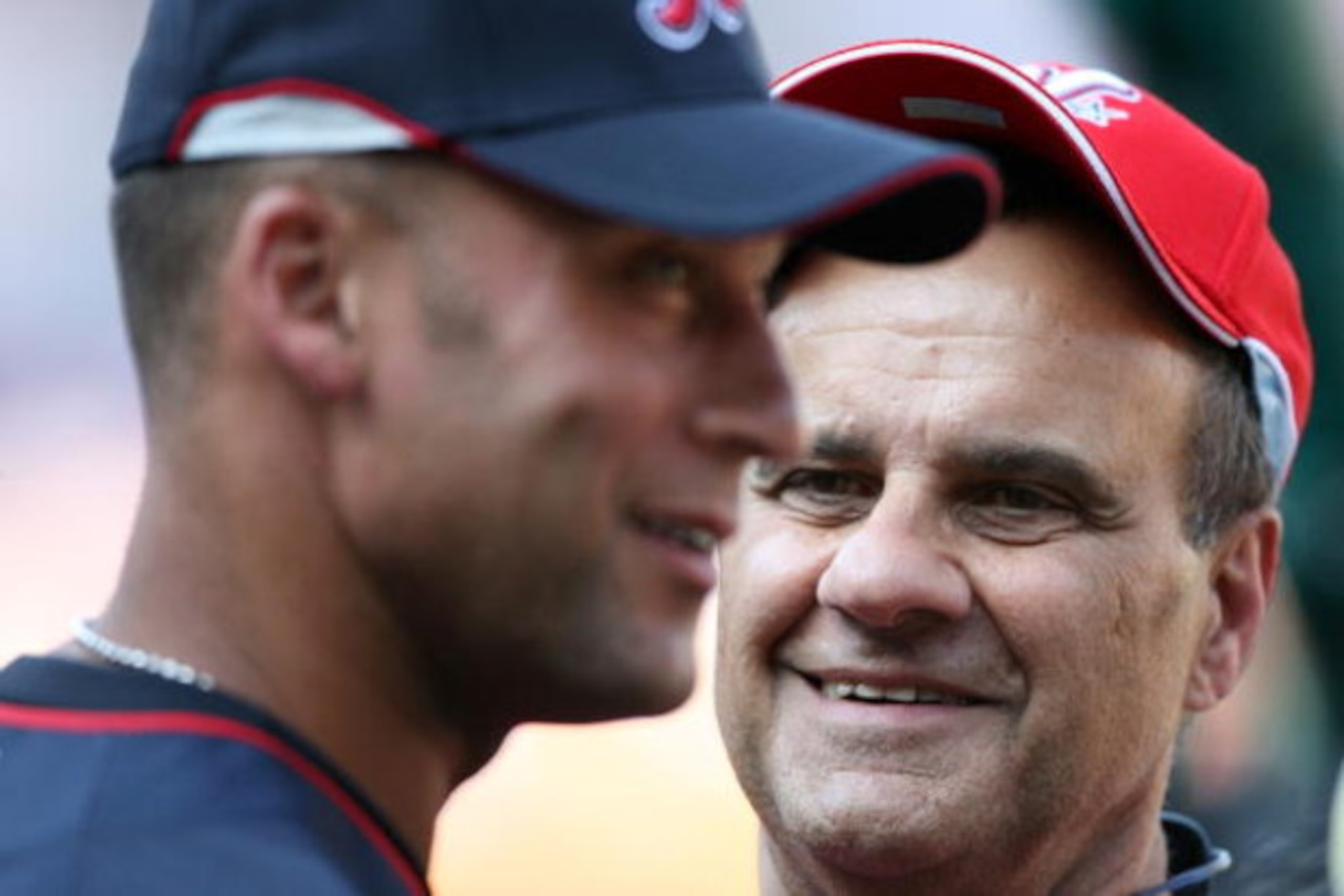 ST LOUIS, MO - JULY 13:  National League All-Star manager Joe Torre of the Los Angeles Dodgers and American League All-Star Derek Jeter of the New York Yankees stand on the field during the Gatorade All-Star Workout Day at Busch Stadium on July 13, 2009 i
