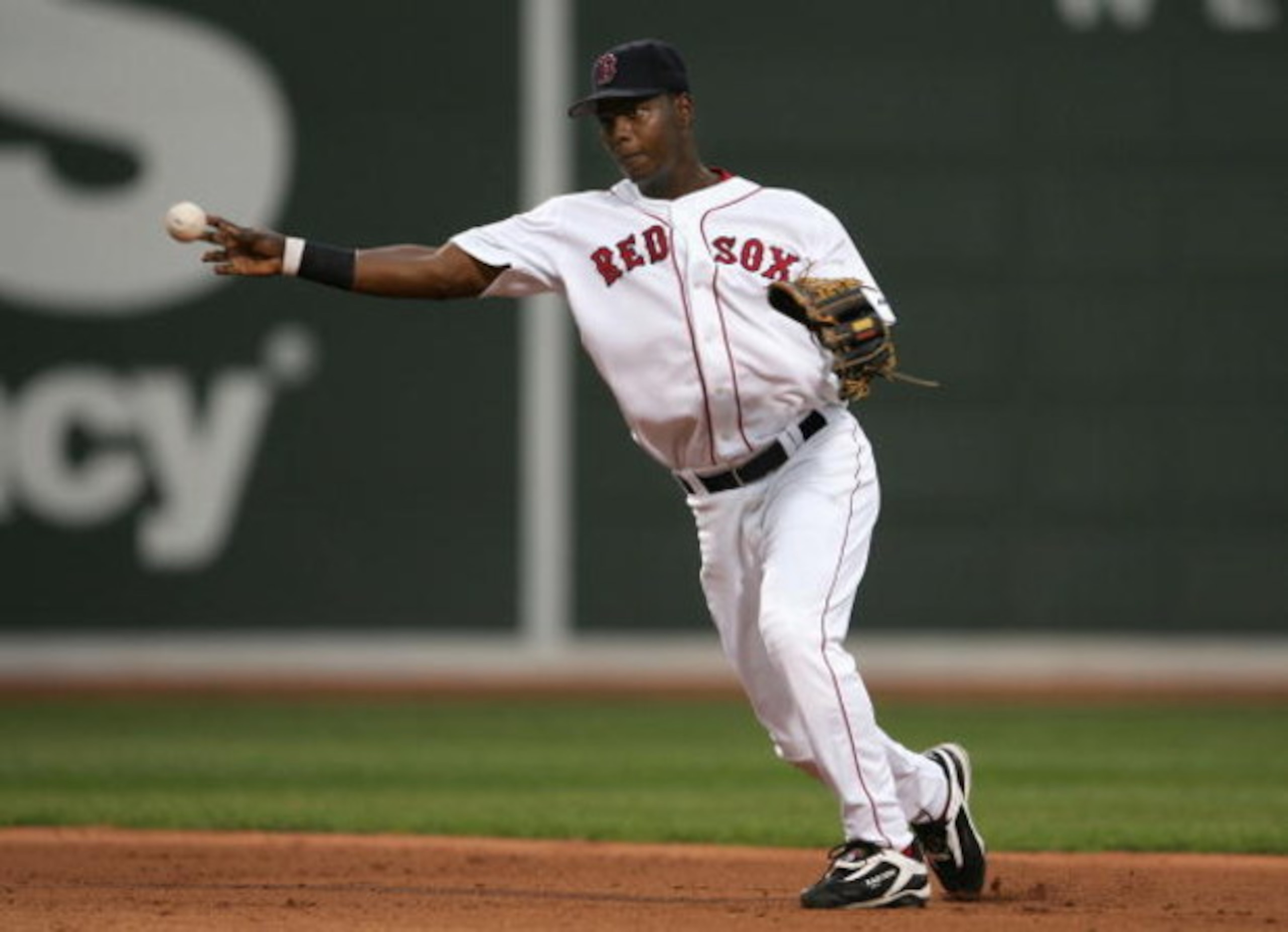 BOSTON - OCTOBER 07:  Shortstop Edgar Renteria #3 of the Boston Red Sox throws to first base for an out against the Chicago White Sox during Game Three of the American League Division Series at Fenway Park on October 7, 2005 in Boston, Massachusetts.  (Ph