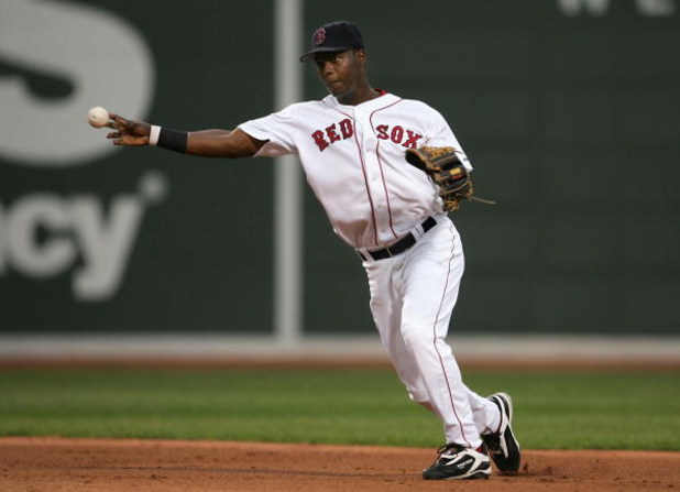 BOSTON - OCTOBER 07:  Shortstop Edgar Renteria #3 of the Boston Red Sox throws to first base for an out against the Chicago White Sox during Game Three of the American League Division Series at Fenway Park on October 7, 2005 in Boston, Massachusetts.  (Ph
