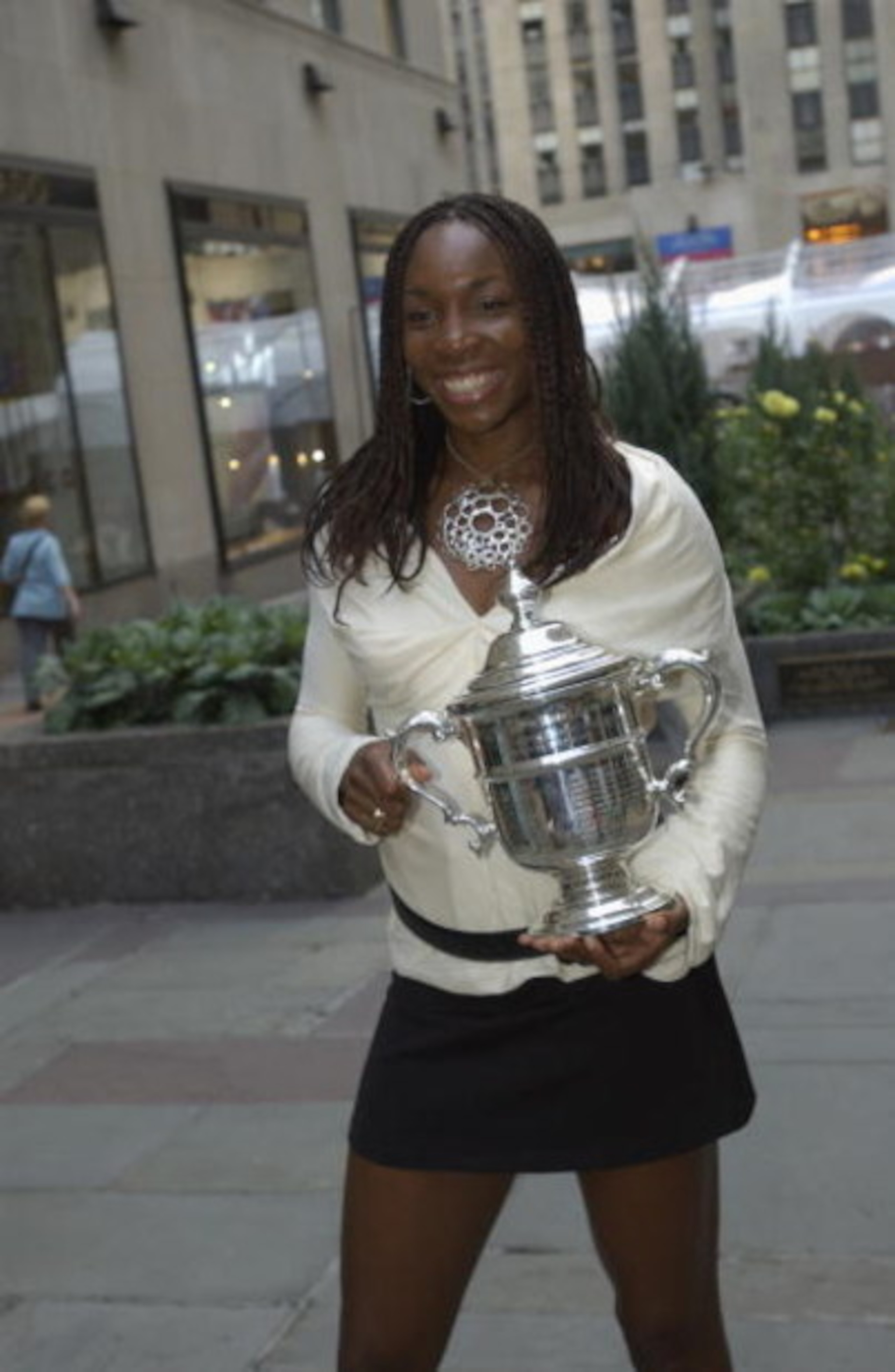 NEW YORK - SEPTEMBER 10:  Venus Williams poses with the U.S. Open Women's singles trophy (she won two days earlier by defeating her younger sister Serena 6-2, 6-4 for her second straight title) in New York, New York on September 10, 2001.  (Photo by Ezra 