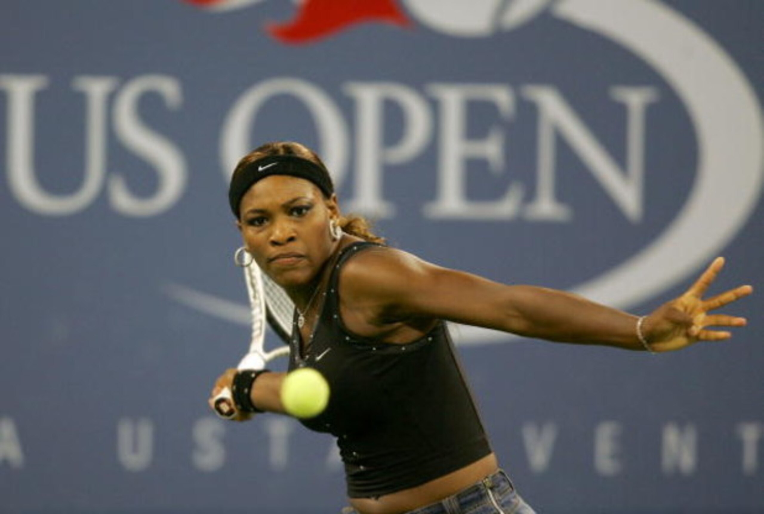 NEW YORK - SEPTEMBER 7:  Serena Williams rreturns a shot to Jennifer Capriati during the US Open September 7, 2004 at the USTA National Tennis Center in Flushing Meadows Corona Park in the Flushing neighborhood of the Queens borough of New York. Capriati 