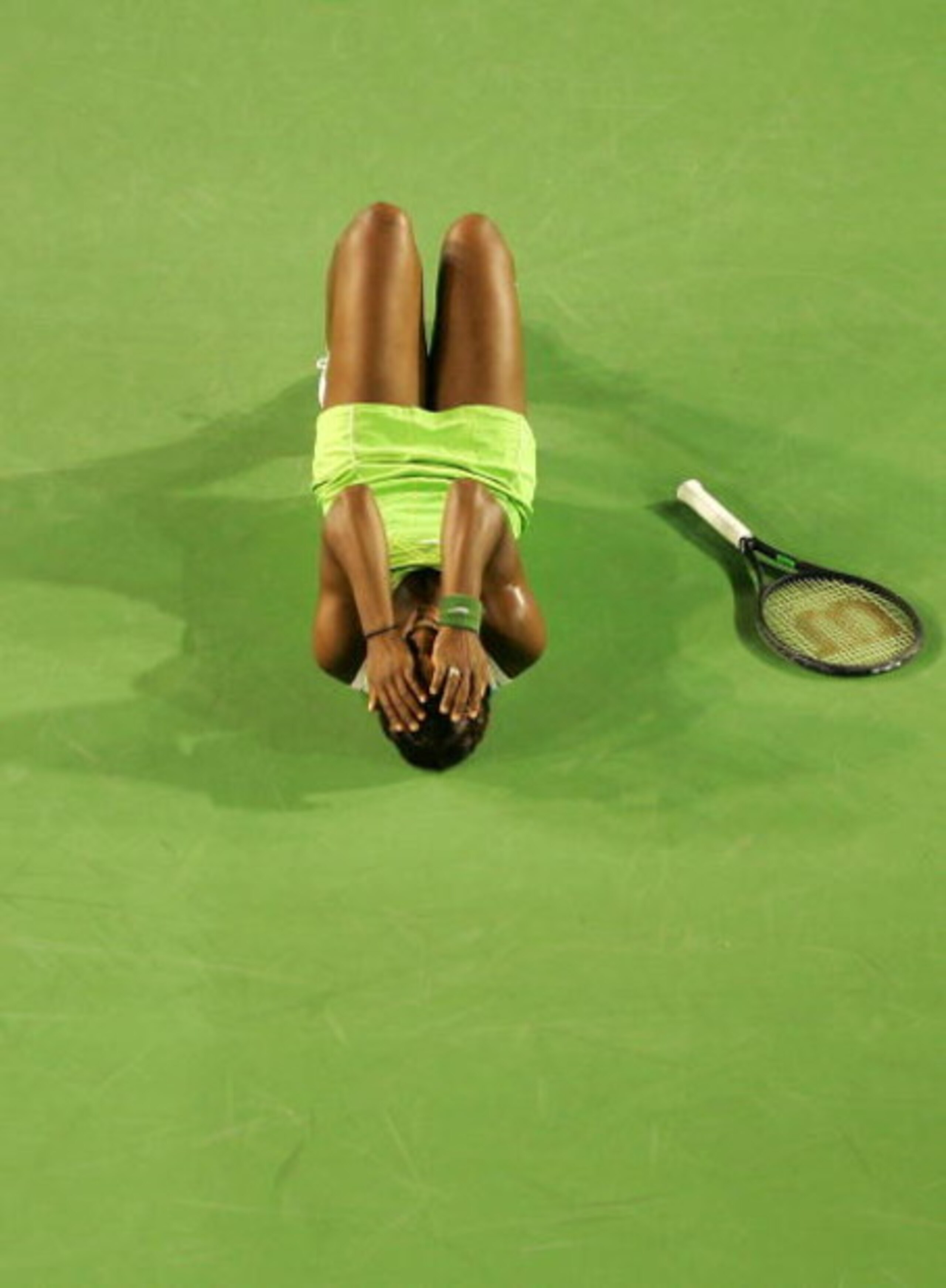MELBOURNE, AUSTRALIA - JANUARY 27:  Serena Williams of the USA celebrates winning her women's final match against Maria Sharapova of Russia on day thirteen of the Australian Open 2007 at Melbourne Park on January 27, 2007 in Melbourne, Australia.  (Photo 