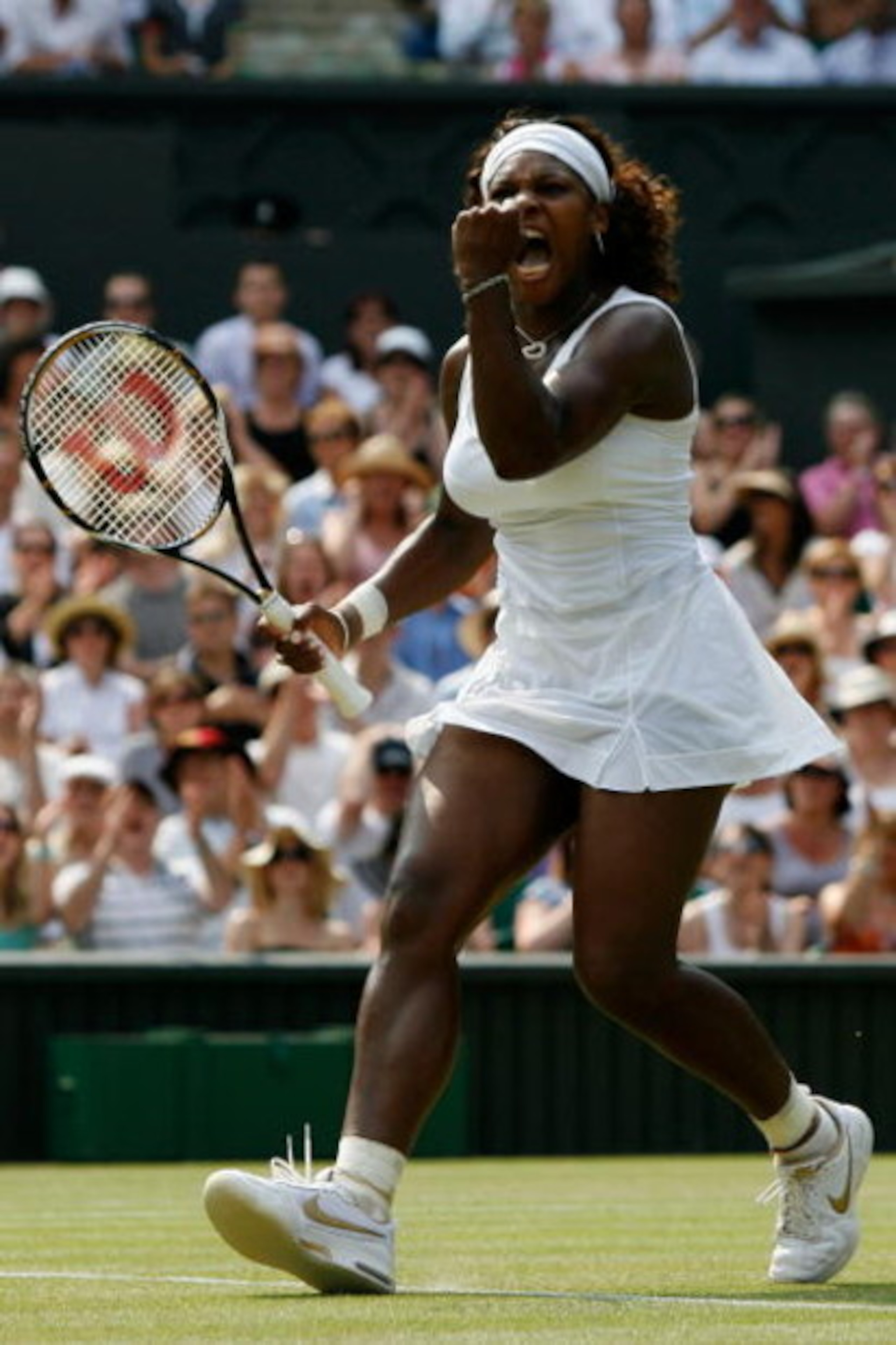 WIMBLEDON, ENGLAND - JULY 02:  Serena Williams of USA celebrates during the women's singles semi final match against Elena Dementieva of Russia on Day Ten of the Wimbledon Lawn Tennis Championships at the All England Lawn Tennis and Croquet Club on July 2
