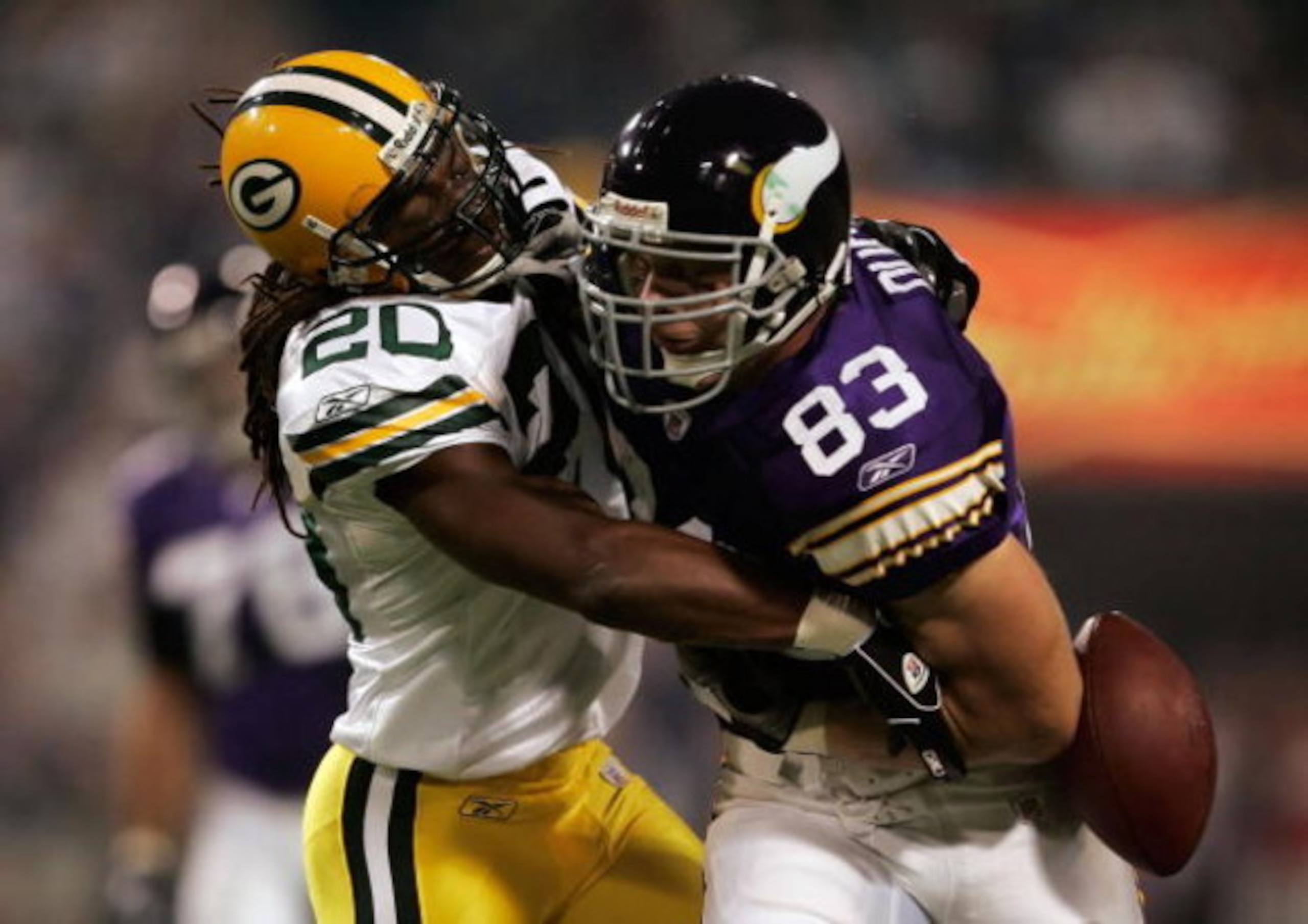 MINNEAPOLIS, MN - SEPTEMBER 30:  Atari Bigby #20 of the Green Bay Packers strips the ball from Jeff Dugan #83 of the Minnesota Vikings resulting in a fumble in the first quarter at the Metrodome on September 30, 2007 in Minneapolis, Minnesota.  (Photo by 