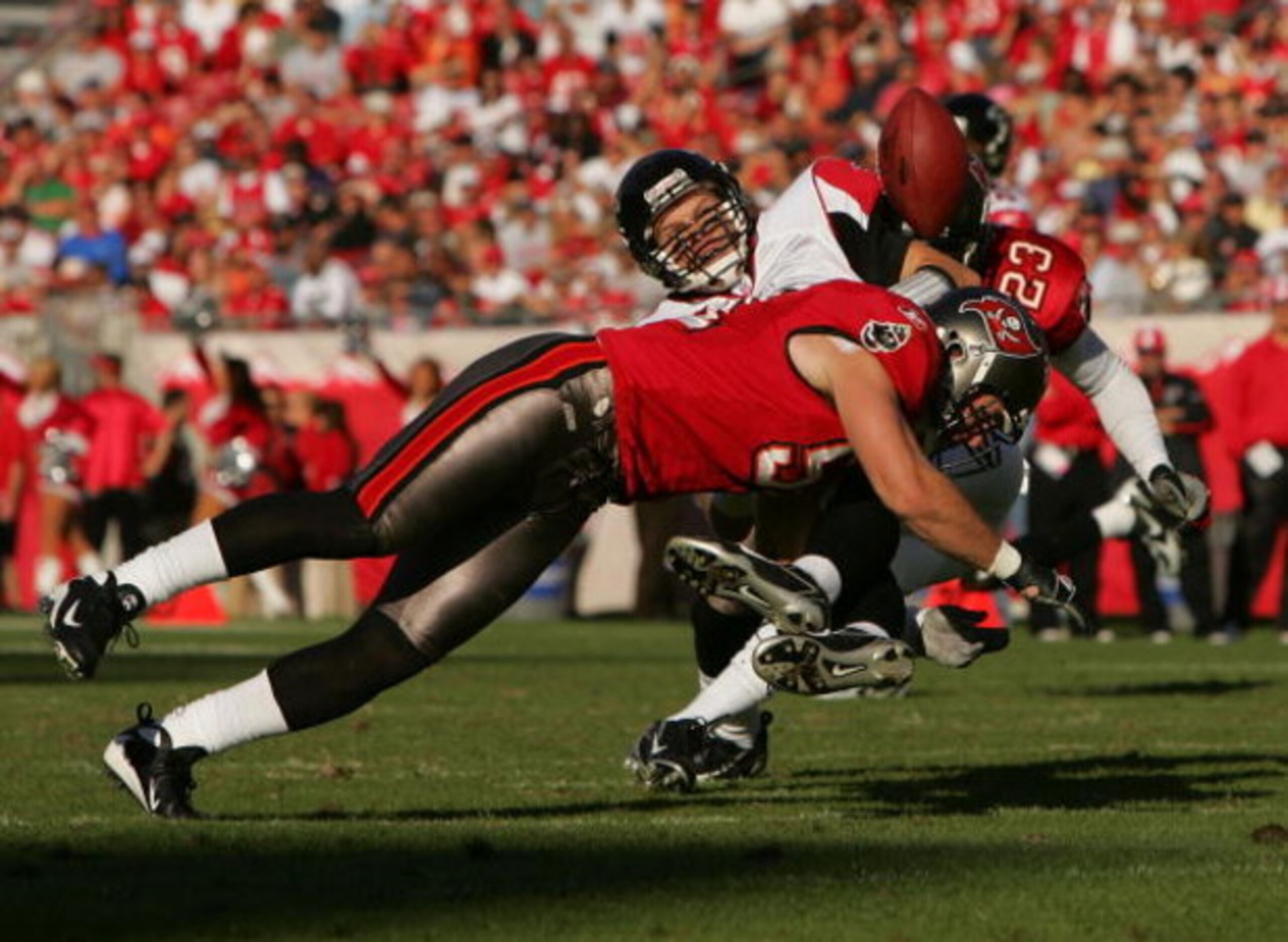 TAMPA, FL - DECEMBER 16:  Barrett Ruud #51 of the Tampa Bay Buccaneers tackles Chris Redman #8 of the Atlanta Falcons at Raymond James Stadium on December 16, 2007 in Tampa, Florida. (Photo by Sam Greenwood/Getty Images)