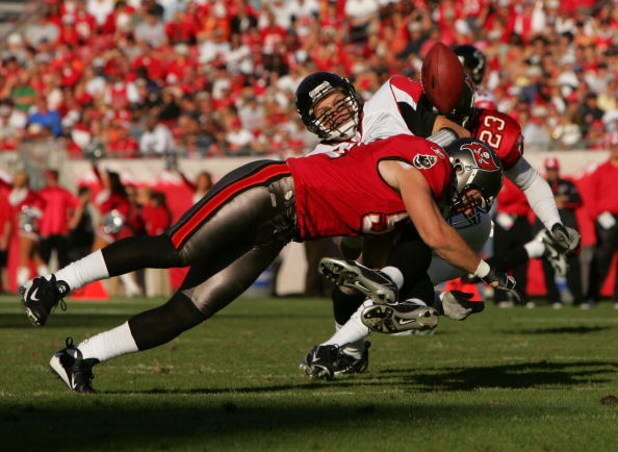 TAMPA, FL - DECEMBER 16:  Barrett Ruud #51 of the Tampa Bay Buccaneers tackles Chris Redman #8 of the Atlanta Falcons at Raymond James Stadium on December 16, 2007 in Tampa, Florida. (Photo by Sam Greenwood/Getty Images)
