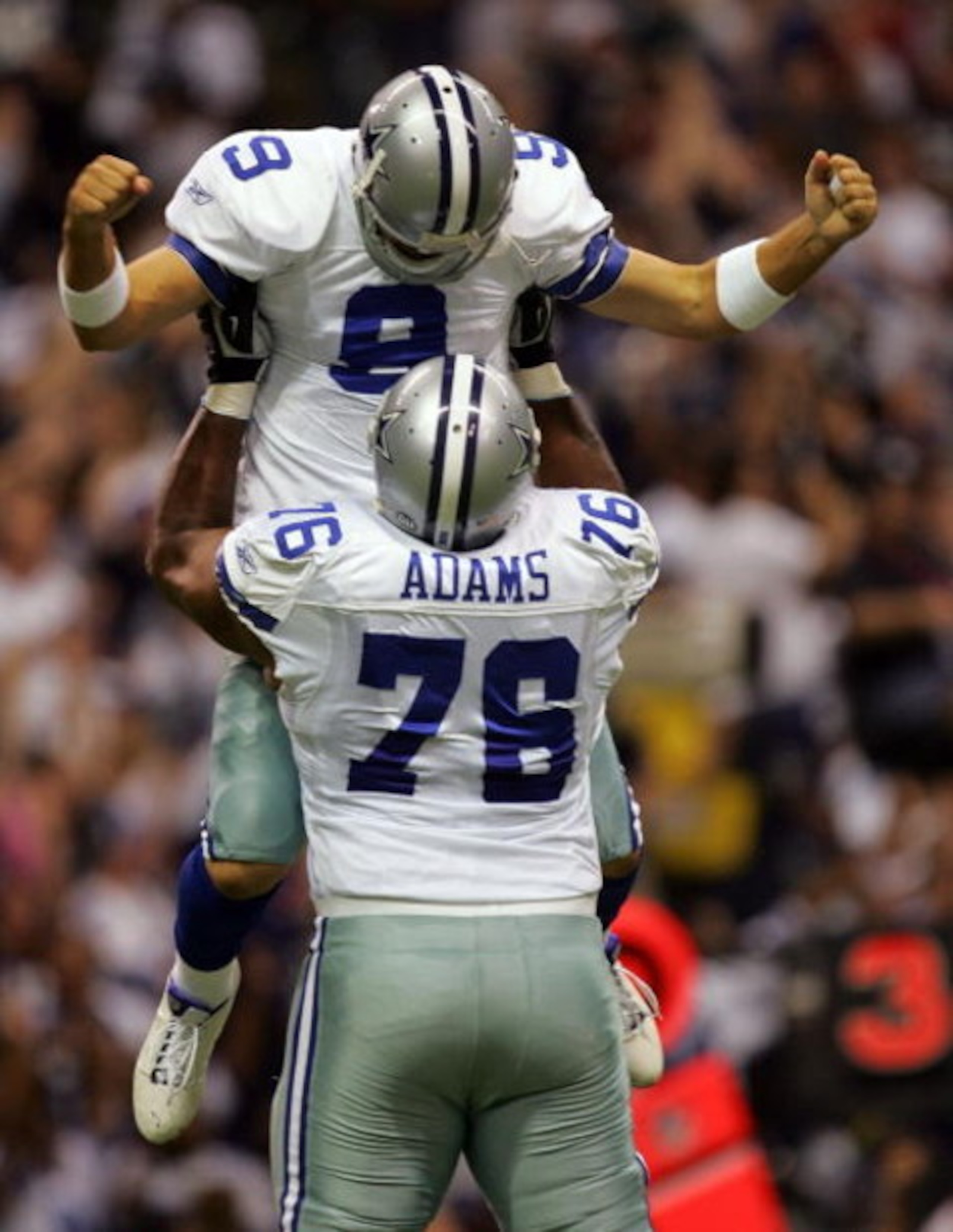 DALLAS - SEPTEMBER 15:  Quarterback Tony Romo #9 of the Dallas Cowboys celebrates a touchdown pass with Flozell Adams #76 against the Philadelphia Eagles in the first quarter at Texas Stadium on September 15, 2008 in Irving, Texas.  (Photo by Ronald Marti