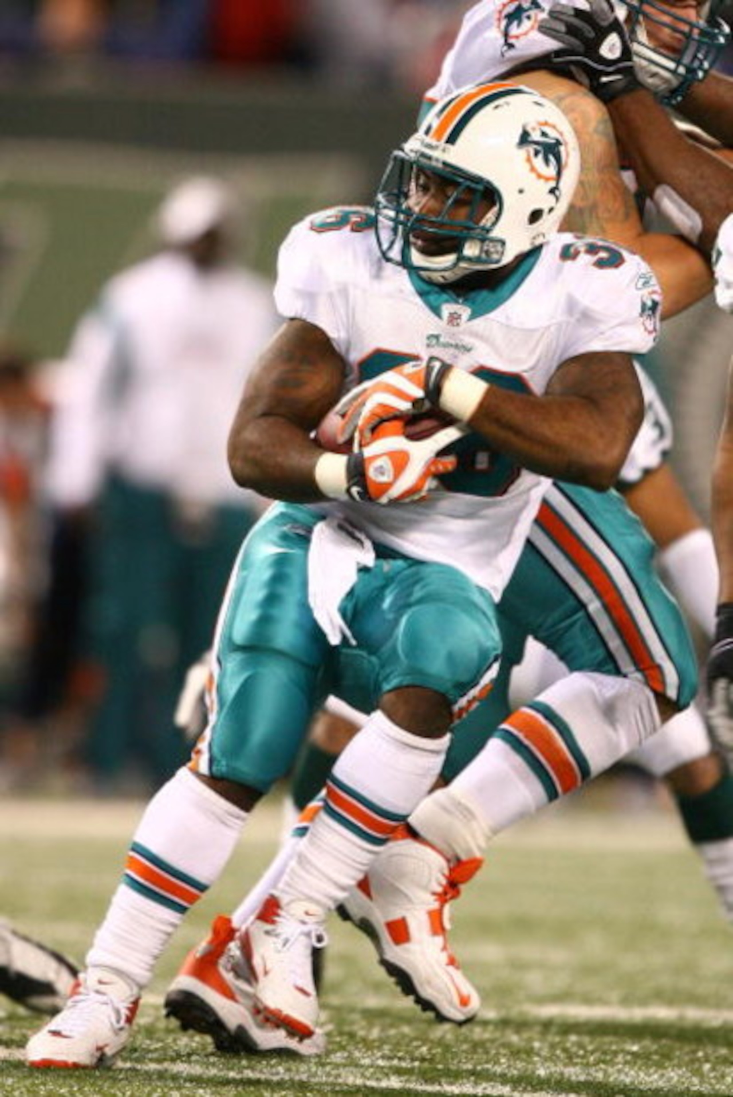 EAST RUTHERFORD, NJ - DECEMBER 28:  Lousaka Polite #36  of The Miami Dolphins runs the ball against The New York Jets during their game on December 28, 2008 at Giants Stadium in East Rutherford, New Jersey.  (Photo by Al Bello/Getty Images)