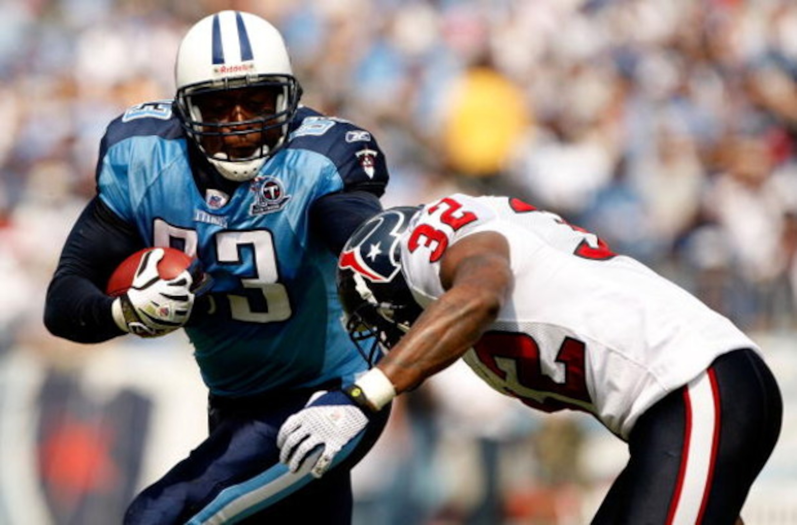 NASHVILLE, TN - SEPTEMBER 21:  Fred Bennett #32 of the Houston Texans tackles Alge Crumpler #83 of the Tennessee Titans during their game at LP Field on September 21, 2008 in Nashville, Tennessee.  (Photo by Streeter Lecka/Getty Images)
