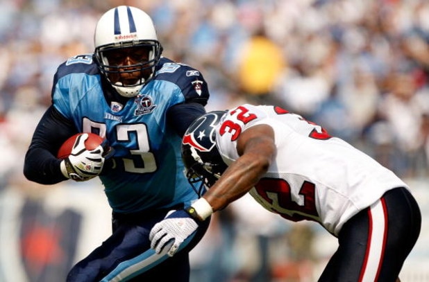 NASHVILLE, TN - SEPTEMBER 21:  Fred Bennett #32 of the Houston Texans tackles Alge Crumpler #83 of the Tennessee Titans during their game at LP Field on September 21, 2008 in Nashville, Tennessee.  (Photo by Streeter Lecka/Getty Images)