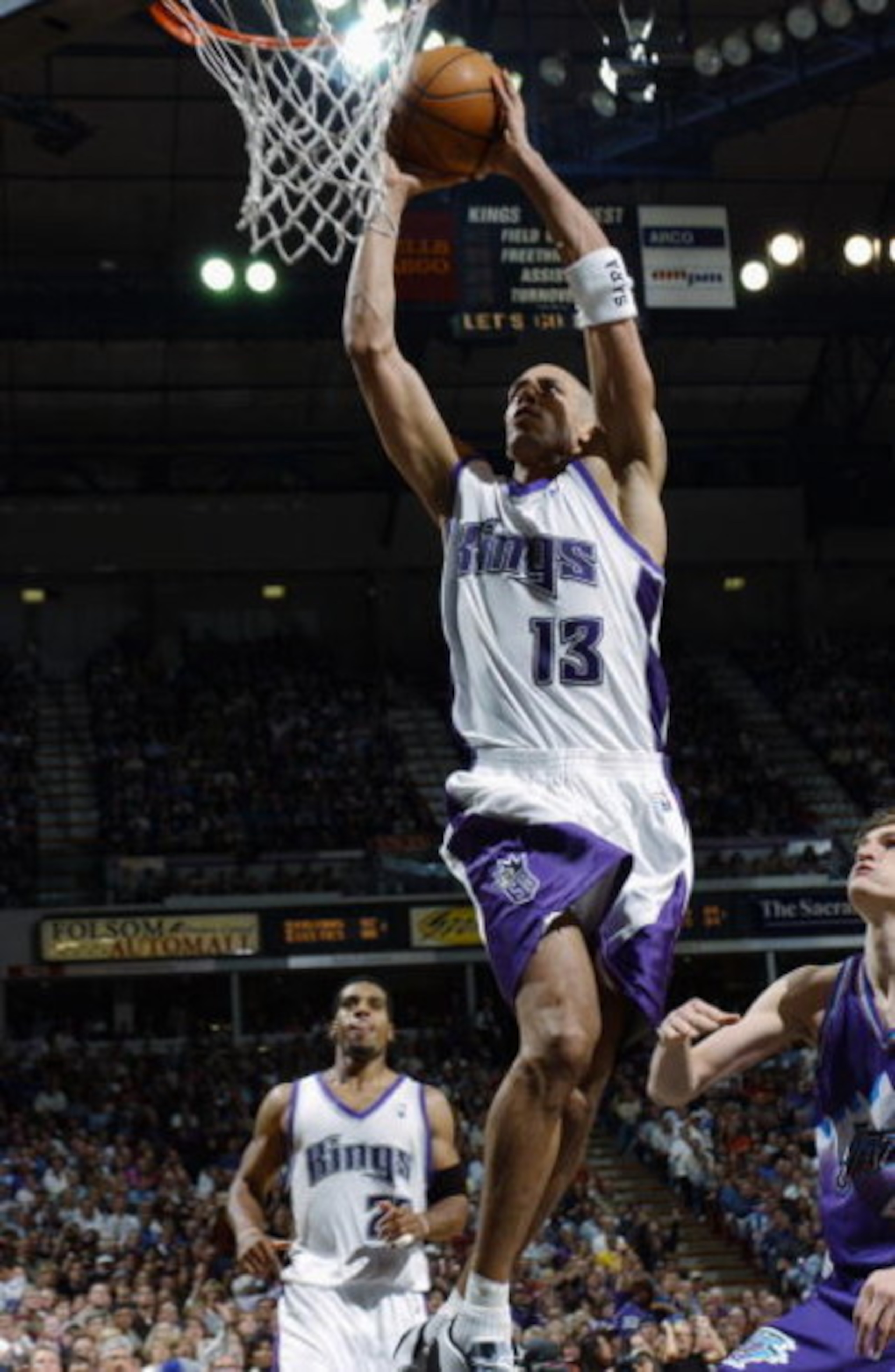 SACRAMENTO, CA - APRIL 16:  Doug Christie #13 of the Sacramento Kings dunks against the Utah Jazz during the game at Arco Arena on April 16, 2003 in Sacramento, California.  The Kings won 95-84.  NOTE TO USER: User expressly acknowledges and agrees that, 
