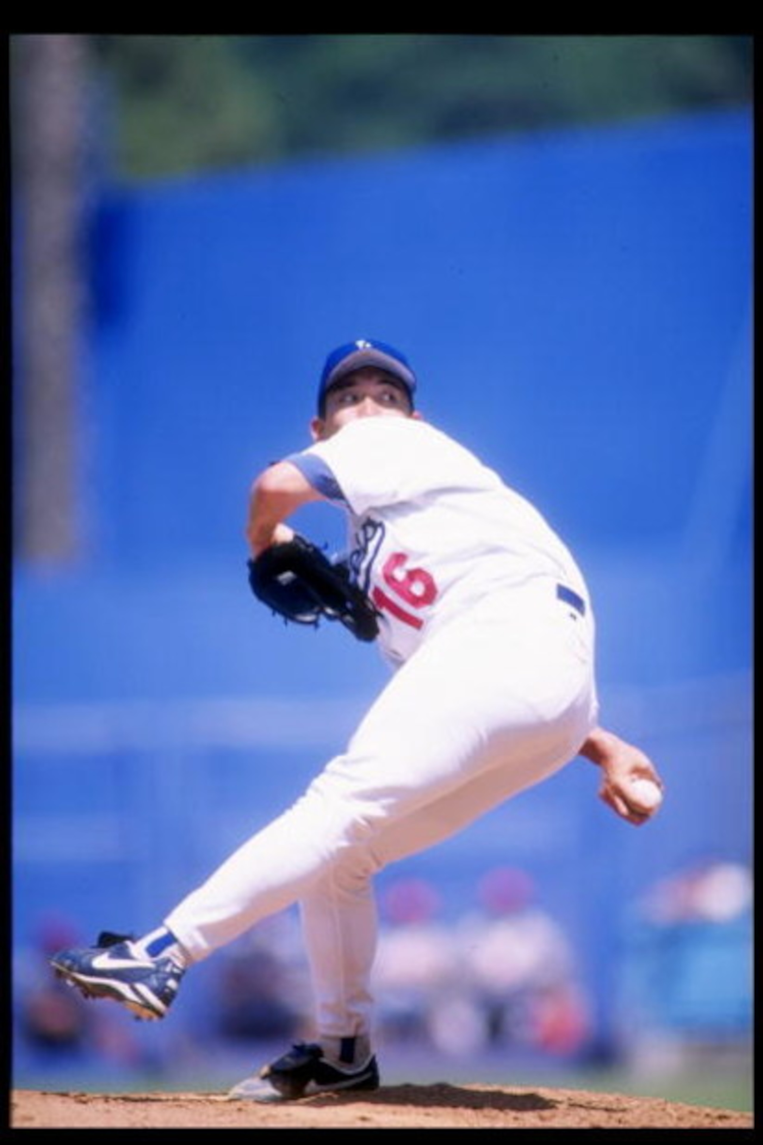 30 Jul 1995: Pitcher Hideo Nomo of the Los Angeles Dodgers winds up for the pitch during a game against the Cincinnati Reds at Dodger Stadium in Los Angeles, California.  The Dodgers won the game 5-4. Mandatory Credit: Simon Barnett  /Allsport