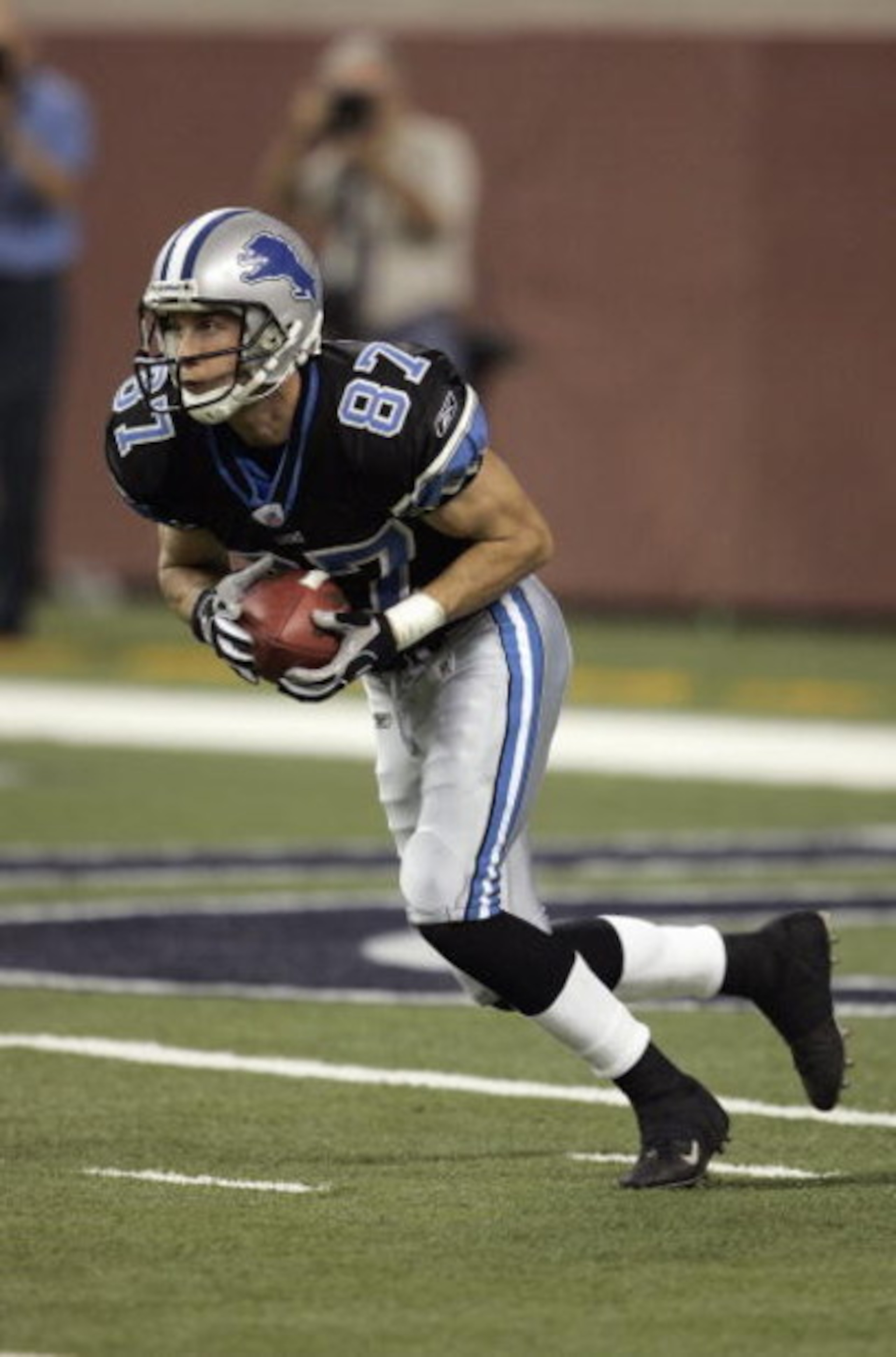 DETROIT - AUGUST 29:  David Kircus #87 of the Detroit Lions returns the ball for yardage against the St. Louis Rams during a pre-season NFL game at Ford Field on August 29, 2005 in Detroit, Michigan.  The Rams won 37-13. (Photo by Tom Pidgeon/Getty Images