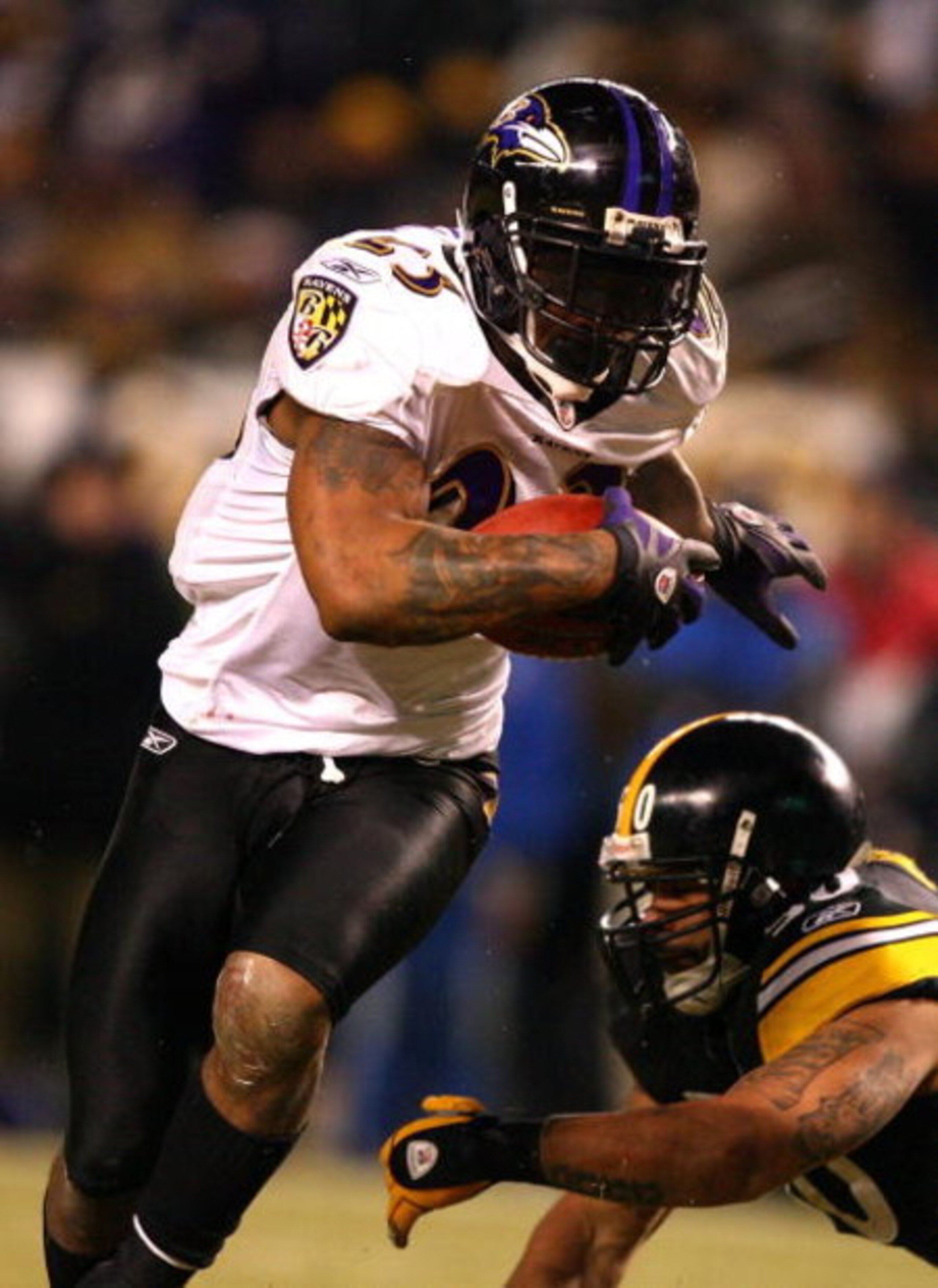 PITTSBURGH - JANUARY 18:  Willis McGahee #23 of the Baltimore Ravens scores a 1-yard rushing touchdown in the fourth quarter against Larry Foote #50 of the Pittsburgh Steelers during the AFC Championship game on January 18, 2009 at Heinz Field in Pittsbur