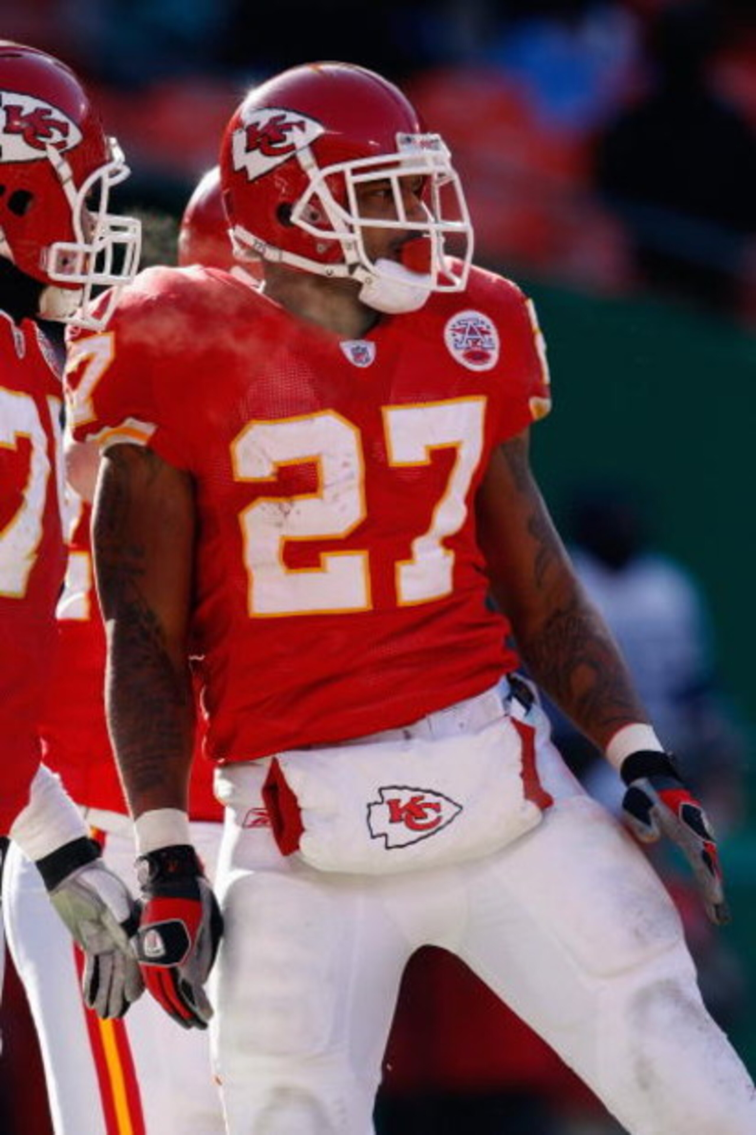 KANSAS CITY, MO - DECEMBER 21:  Larry Johnson #27 of the Kansas City Chiefs looks on during the game against the Miami Dolphins on December 21, 2008 at Arrowhead Stadium in Kansas City, Missouri. (Photo by Jamie Squire/Getty Images)