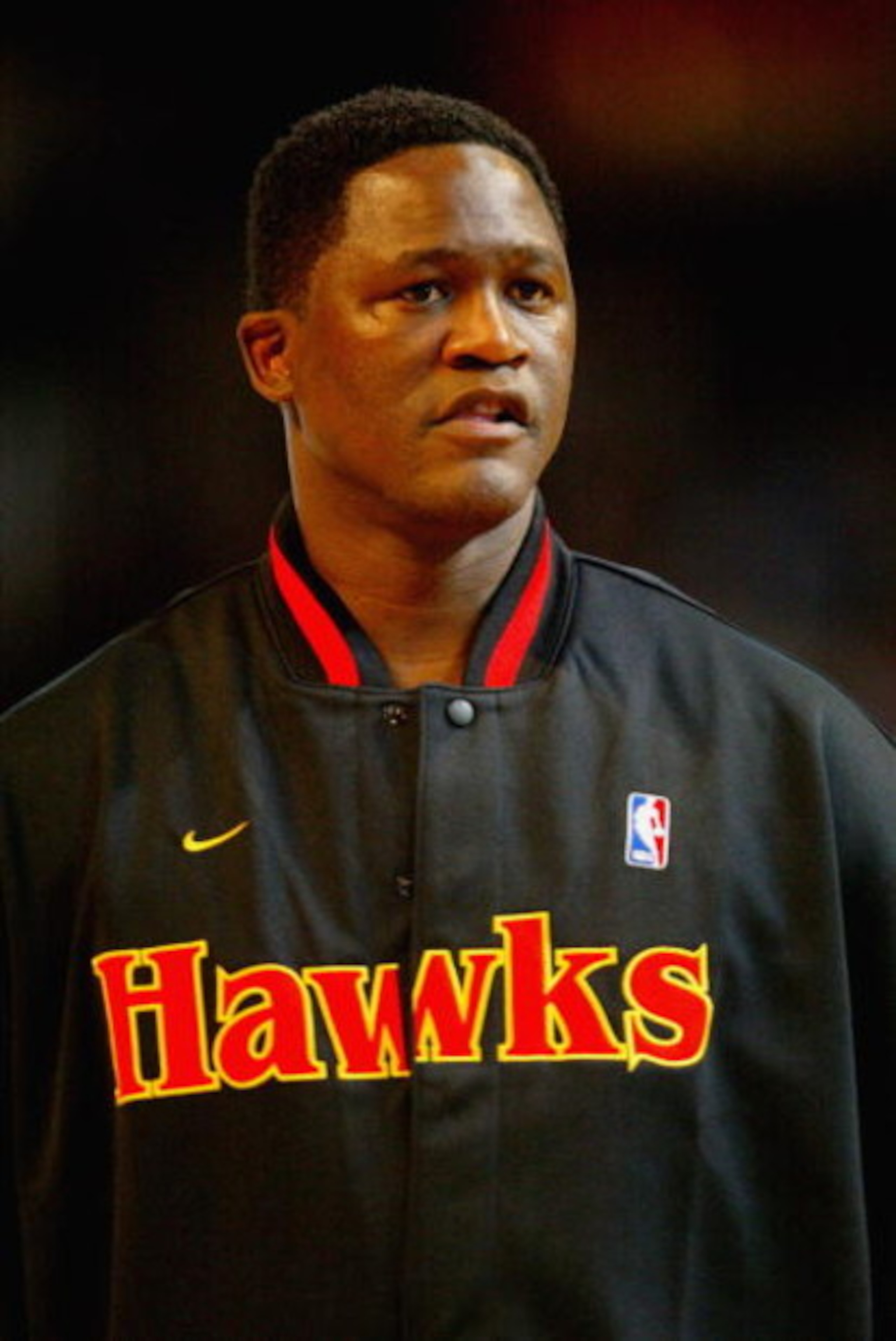 ATLANTA - FEBRUARY 8:  Dominique Wilkins of the Atlanta Team looks on before the Jeep Hoop it Up Game during the 2003 NBA All Star weekend at Philips Arena on February 8, 2003 in Atlanta, Georgia.  NOTE TO USER: User expressly acknowledges and agrees that