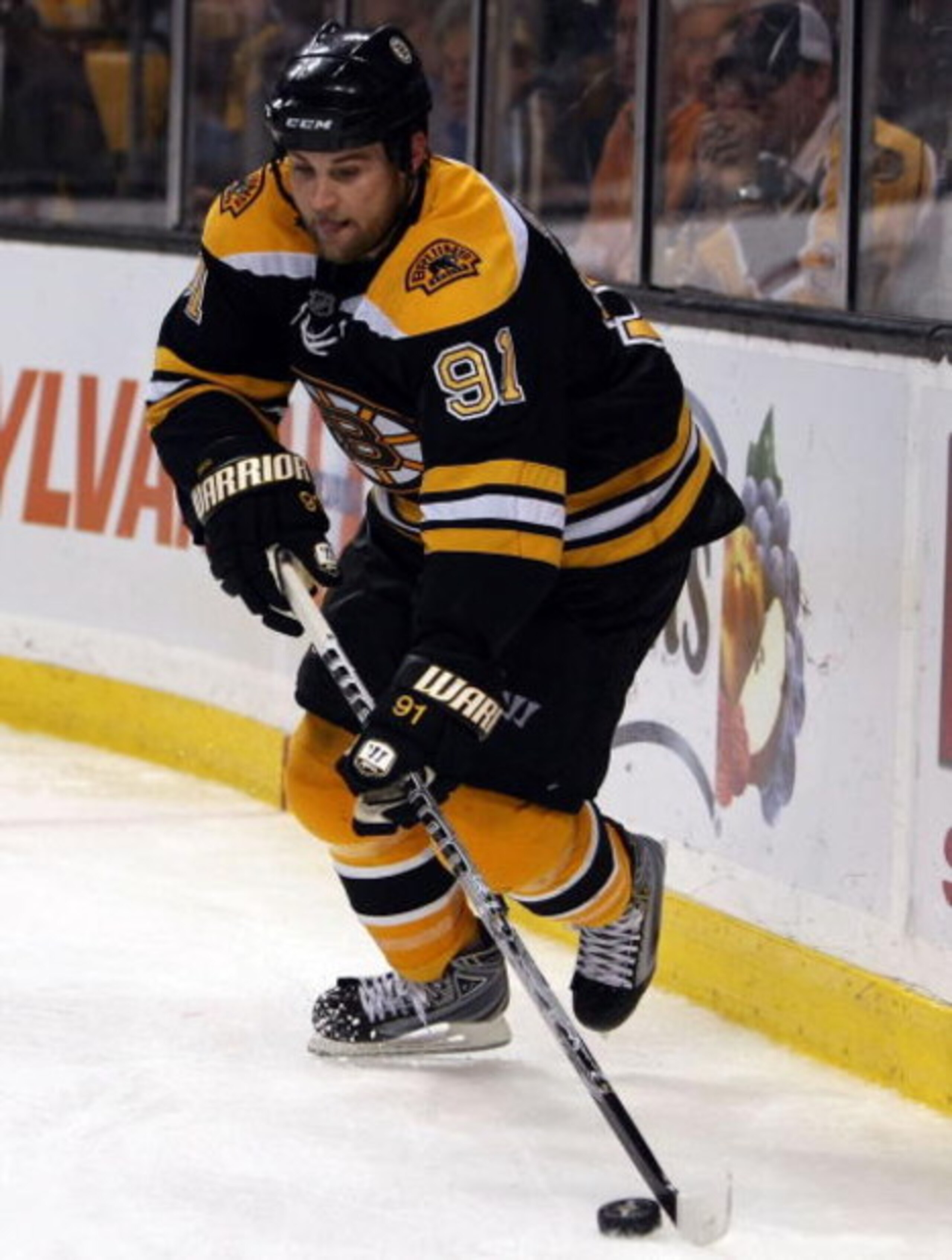 BOSTON - MAY 14:  Marc Savard #91 of the Boston Bruins takes the puck against the Carolina Hurricanes during Game Seven of the Eastern Conference Semifinal Round of the 2009 Stanley Cup Playoffs on May 14, 2009 at the TD Banknorth Garden in Boston, Massac