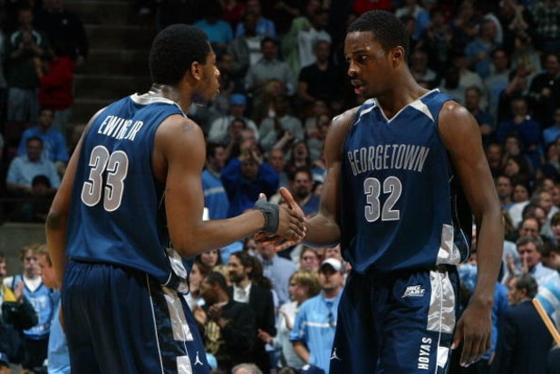 EAST RUTHERFORD, NJ - MARCH 25:  Patrick Ewing Jr. #33 and Jeff Green #32 of the Georgetown Hoyas slaps hands during a timeout against the University of North Carolina Tar Heels in the NCAA Men's East Regional Final at the Continental Airlines Arena in th