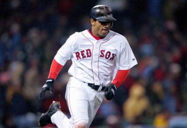 BOSTON - OCTOBER 24:  Orlando Cabrera #44 of the Boston Red Sox runs the bases during game two of the 2004 World Series against the St. Louis Cardinals on October 24, 2004 at Fenway Park in Boston, Massachusetts. (Photo by Elsa/Getty Images)