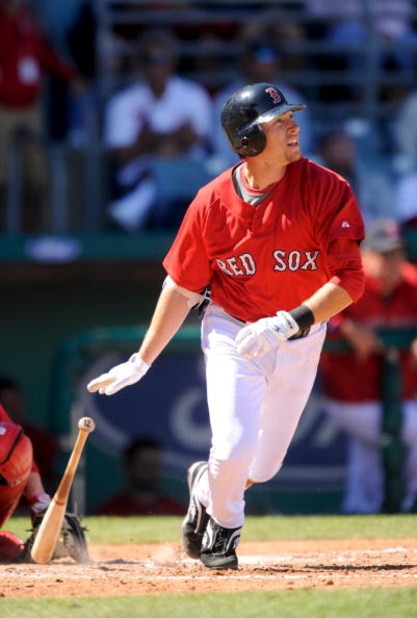 FORT MYERS, FL - MARCH 03: Jed Lowrie #12 of the Boston Red Sox bats against the Cincinnati Reds at the City of Palms Park on March 3, 2009 in Fort Myers, Florida.  (Photo by Rob Tringali/Getty Images)