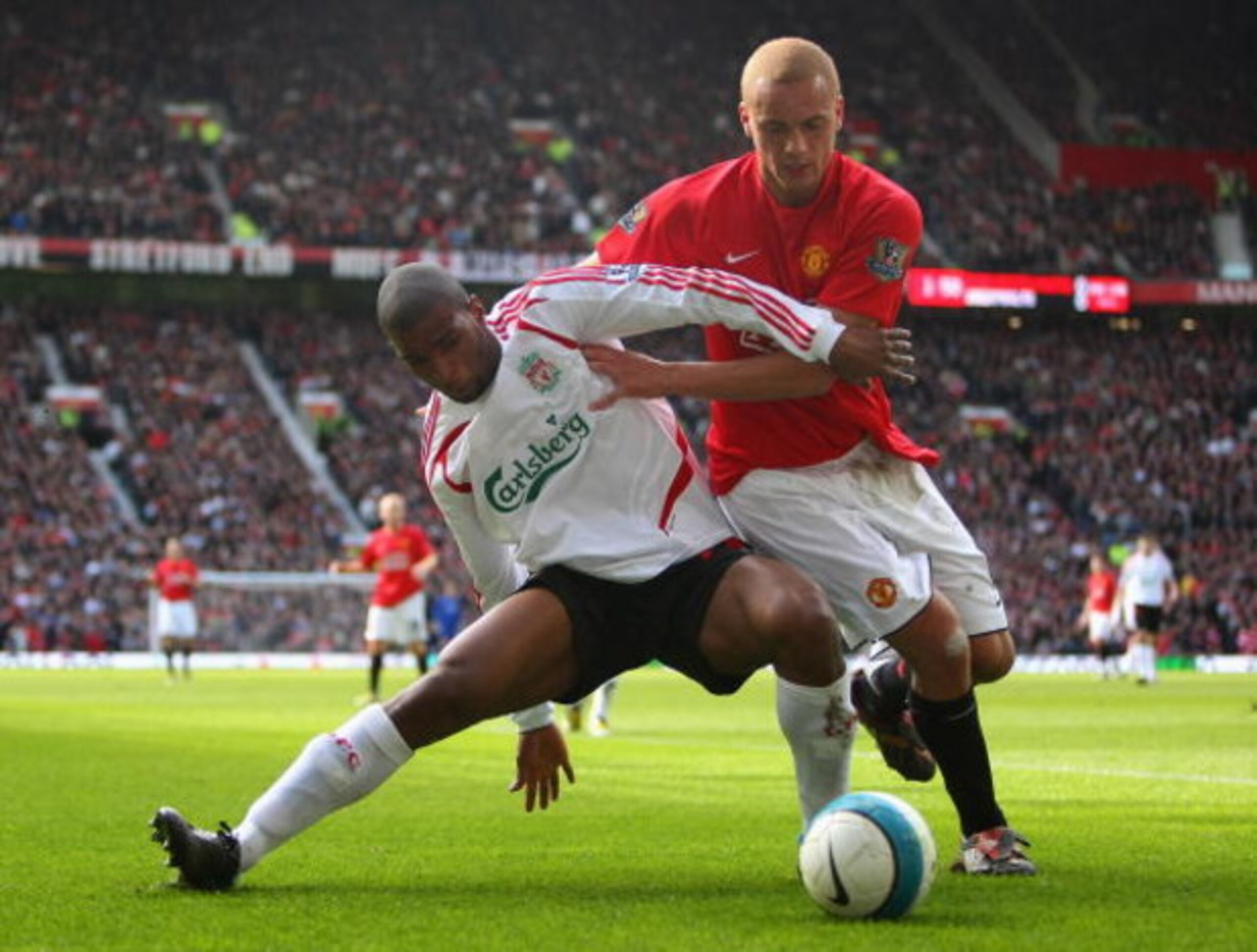 MANCHESTER, UNITED KINGDOM - MARCH 23:  Wes Brown of Manchester United battles for the ball with Ryan Babel of Liverpool during the Barclays Premier League match between Manchester United and Liverpool at Old Trafford on March 23, 2008 in Manchester, Engl