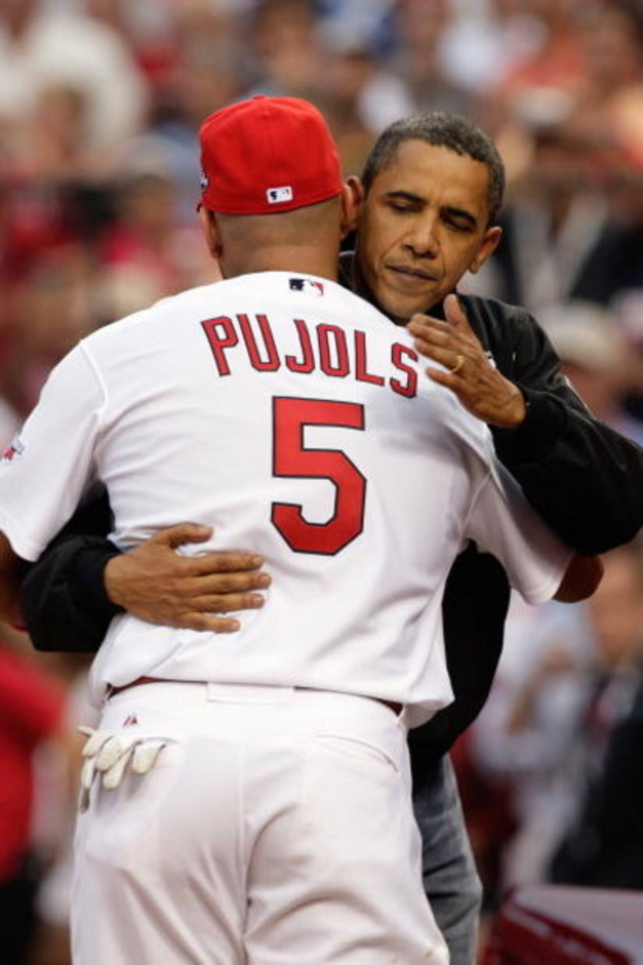 ST. LOUIS, MO - JULY 14: President Barack Obama hugs National League All-Star Albert Pujols of the St. Louis Cardinals after throwing the first pitch before the 2009 MLB All-Star Game at Busch Stadium on July 14, 2009 in St Louis, Missouri. (Photo by Jam ST. LOUIS, MO - JULY 14: President Barack Obama hugs National League All-Star Albert Pujols of the St. Louis Cardinals after throwing the first pitch before the 2009 MLB All-Star Game at Busch Stadium on July 14, 2009 in St Louis, Missouri. (Photo by Jam