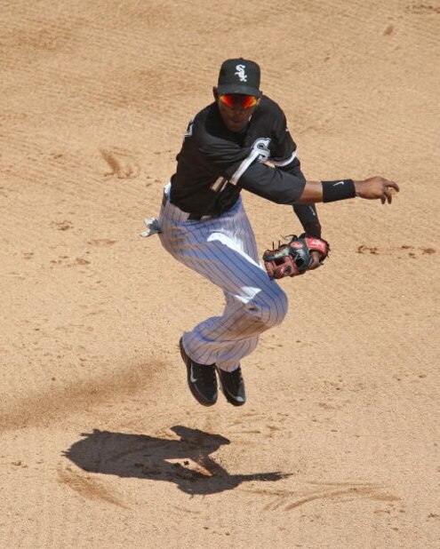 CHICAGO - JUNE 28: Alexei Ramirez #10 of the Chicago White Sox hops after throwing the ball to first base on a double play against the Chicago Cubs on June 28, 2009 at U.S. Cellular Field in Chicago, Illinois. The White Sox defeated the Cubs 6-0. (Photo b