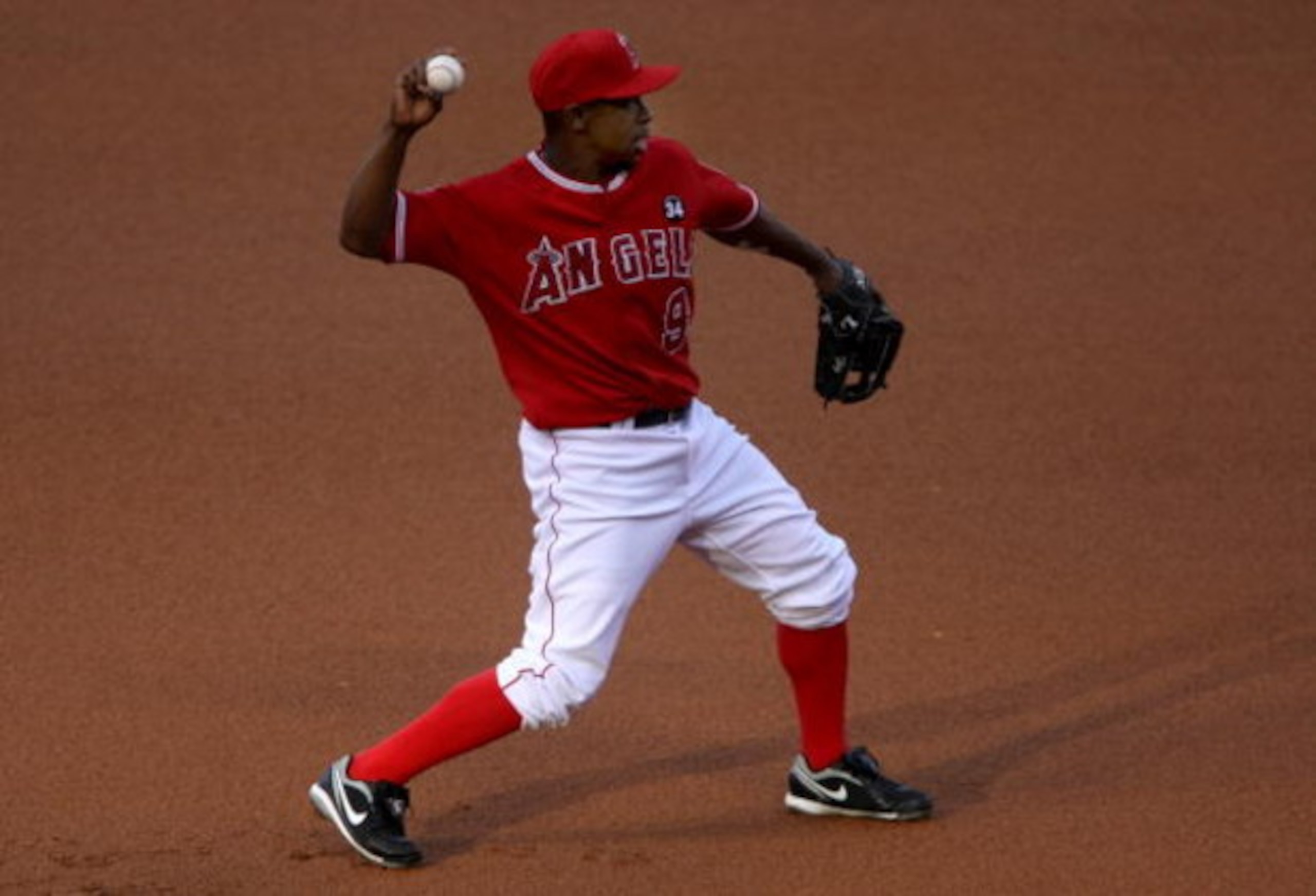 ANAHEIM, CA - JULY 08: Third baseman Chone Figgins #9 of the Los Angeles Angels of Anaheim in the field against the Texas Rangers on July 8, 2009 at Angel Stadium in Anaheim, California. The Rangers won 8-1. (Photo by Stephen Dunn/Getty Images) ANAHEIM, CA - JULY 08: Third baseman Chone Figgins #9 of the Los Angeles Angels of Anaheim in the field against the Texas Rangers on July 8, 2009 at Angel Stadium in Anaheim, California. The Rangers won 8-1. (Photo by Stephen Dunn/Getty Images)