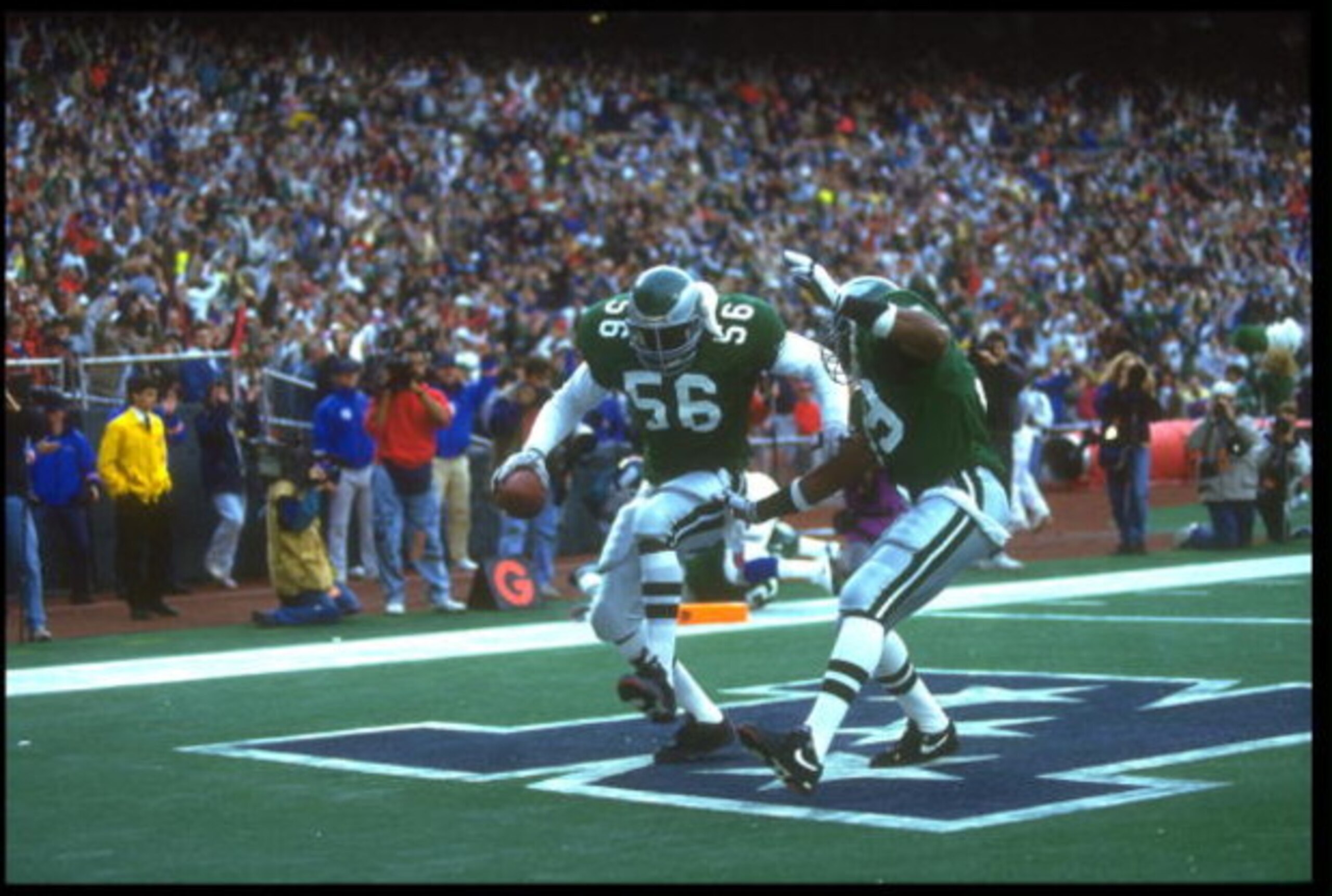 25 NOV 1990:  PHILADELPHIA EAGLES DEFENSEMAN BYRON EVANS #56 PERFORMS A DANCE IN THE ENDZONE AFTER RECOVERING A TURN OVER THAT RESULTED IN A TOUCHDOWN DURING THE EAGLES 31-13 WIN OVER THE NEW YORK GIANTS AT GIANTS STADIUM IN EAST RUTHERFORD, NEW JERSEY.