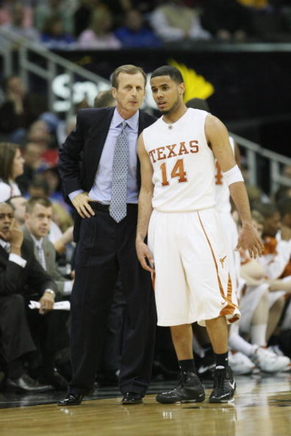 KANSAS CITY, MO - MARCH 14:  Head coach Rick Barnes speaks with D.J. Augustin #14 of the Texas Longhorns  against the Oklahoma State Cowboys during the Phillips 66 Big 12 Championship Quarterfinals at Sprint Center on March 14, 2008 in Kansas City, Missou