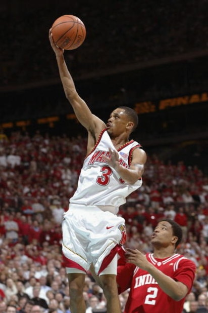 ATLANTA, GA - APRIL 1:  Juan Dixon #3 of the University of Maryland Terrapins drives past A.J. Moye #2 of the Indiana University Hoosiers during the men's NCAA National Championship game at the Georgia Dome in Atlanta, Georgia. Maryland won, 64-52. (Photo